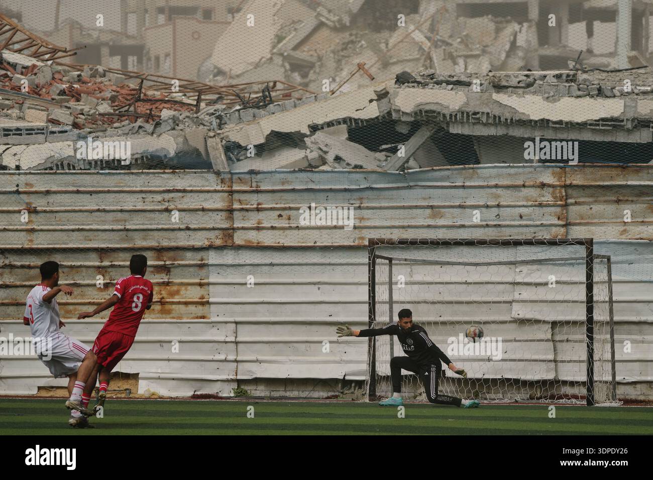 A Palestinian player of Gaza Sports Club, left, kicks the ball during a ...
