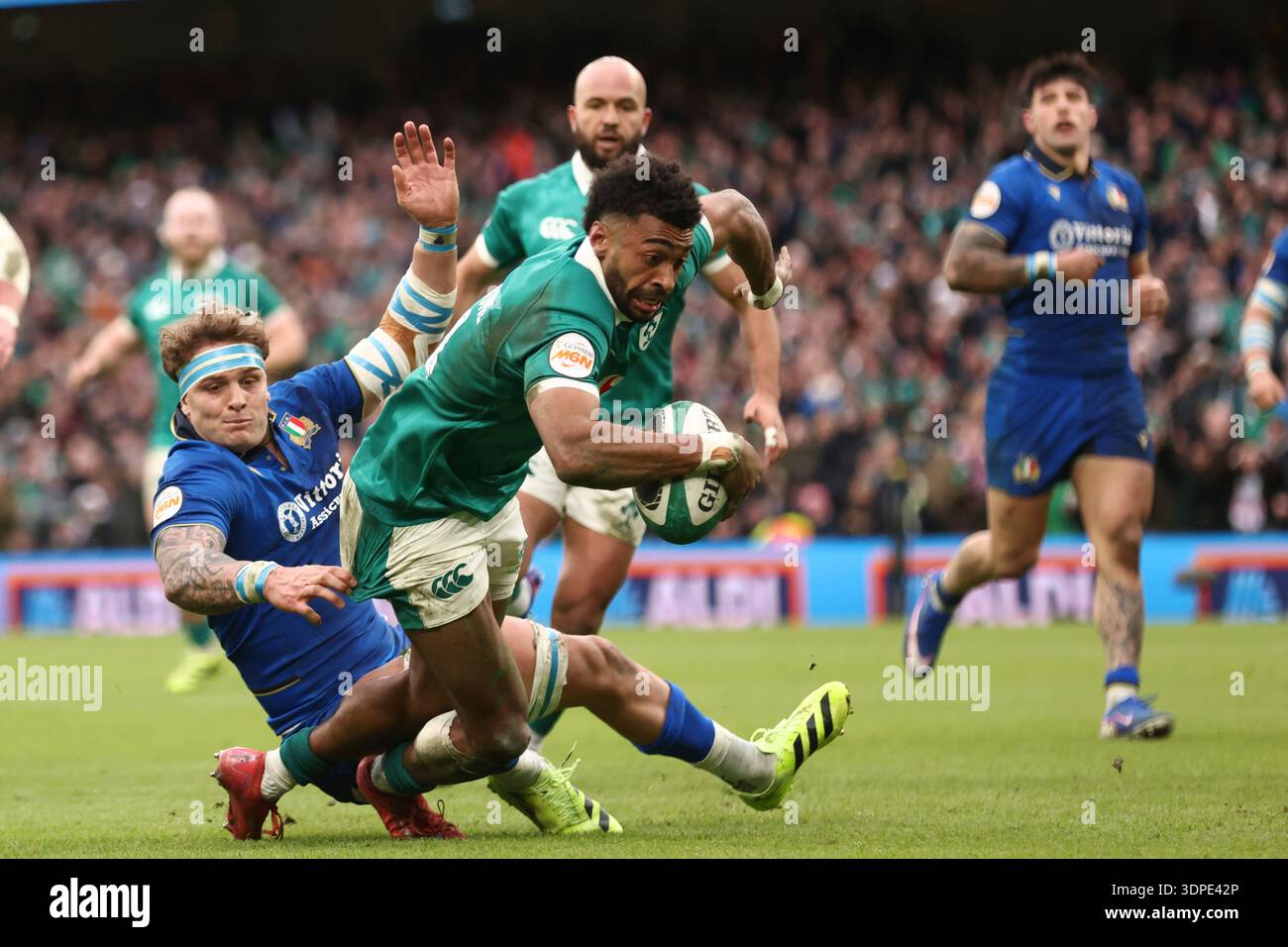 Ireland's Robert Baloucoune, goes over the line to score a try during a ...