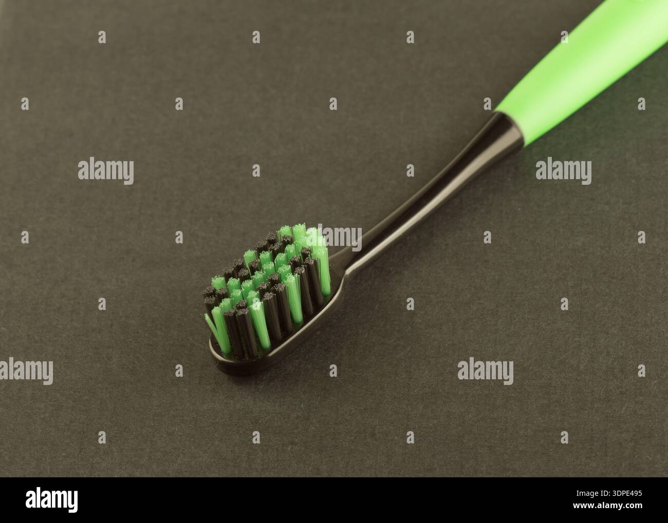 new modern toothbrush isolated on black solid background Stock Photo