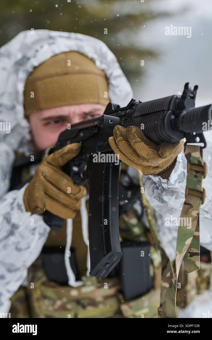 Soldier Aiming Assault Rifle in Winter Camouflage During Snowy Military ...