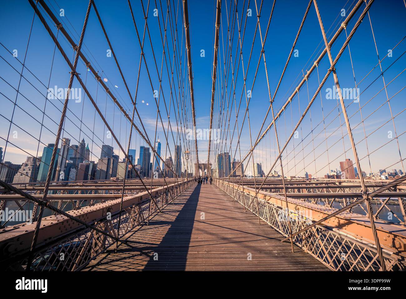 Fantastic view of the famous Brooklyn Bridge crossing the East River in New York City, NY, USA, on a cold winter day looking towards Lower Manhattan Stock Photo