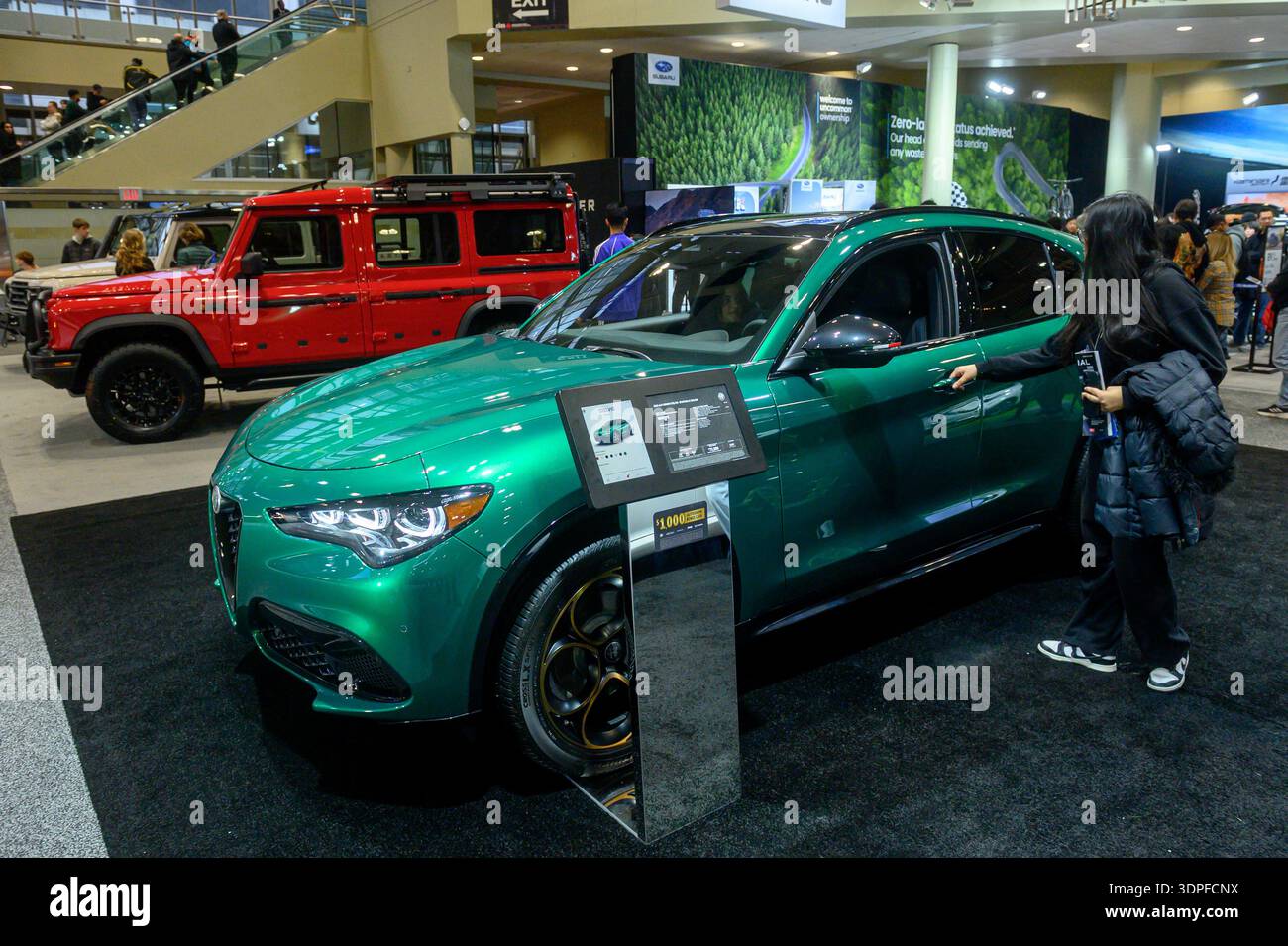 Toronto, ON, Canada - February 13, 2026: Woman opens door of new Alfa ...