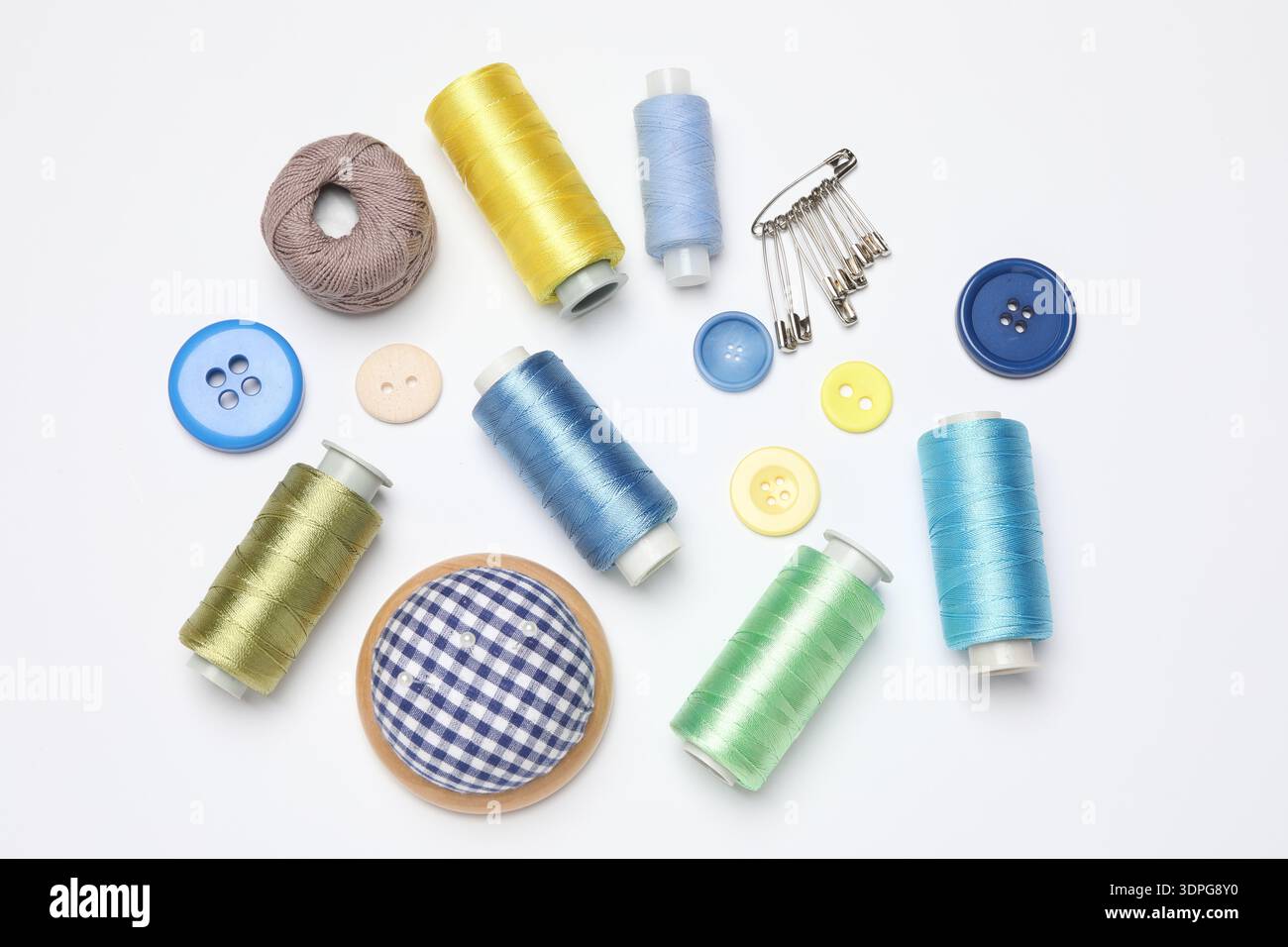 Flat lay composition with different sewing supplies on white background Stock Photo