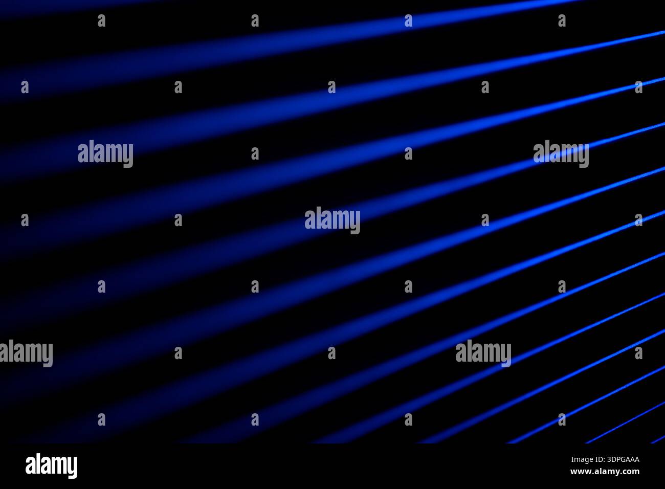 Blue neon light dissolves in darkness. Soft neon. Stock Photo
