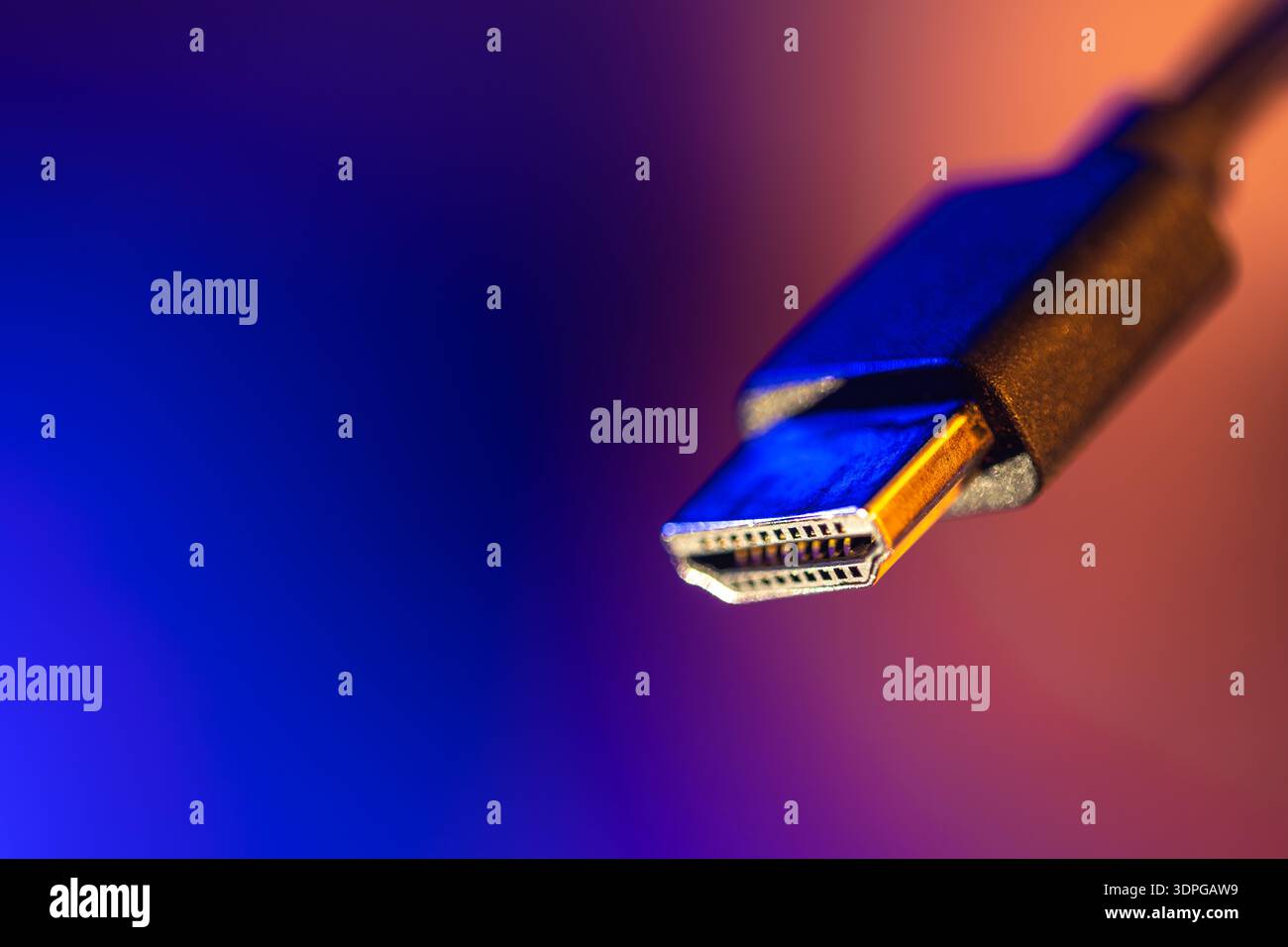 Hdmi plug in focus on blue copyspace. Neon connection. Stock Photo