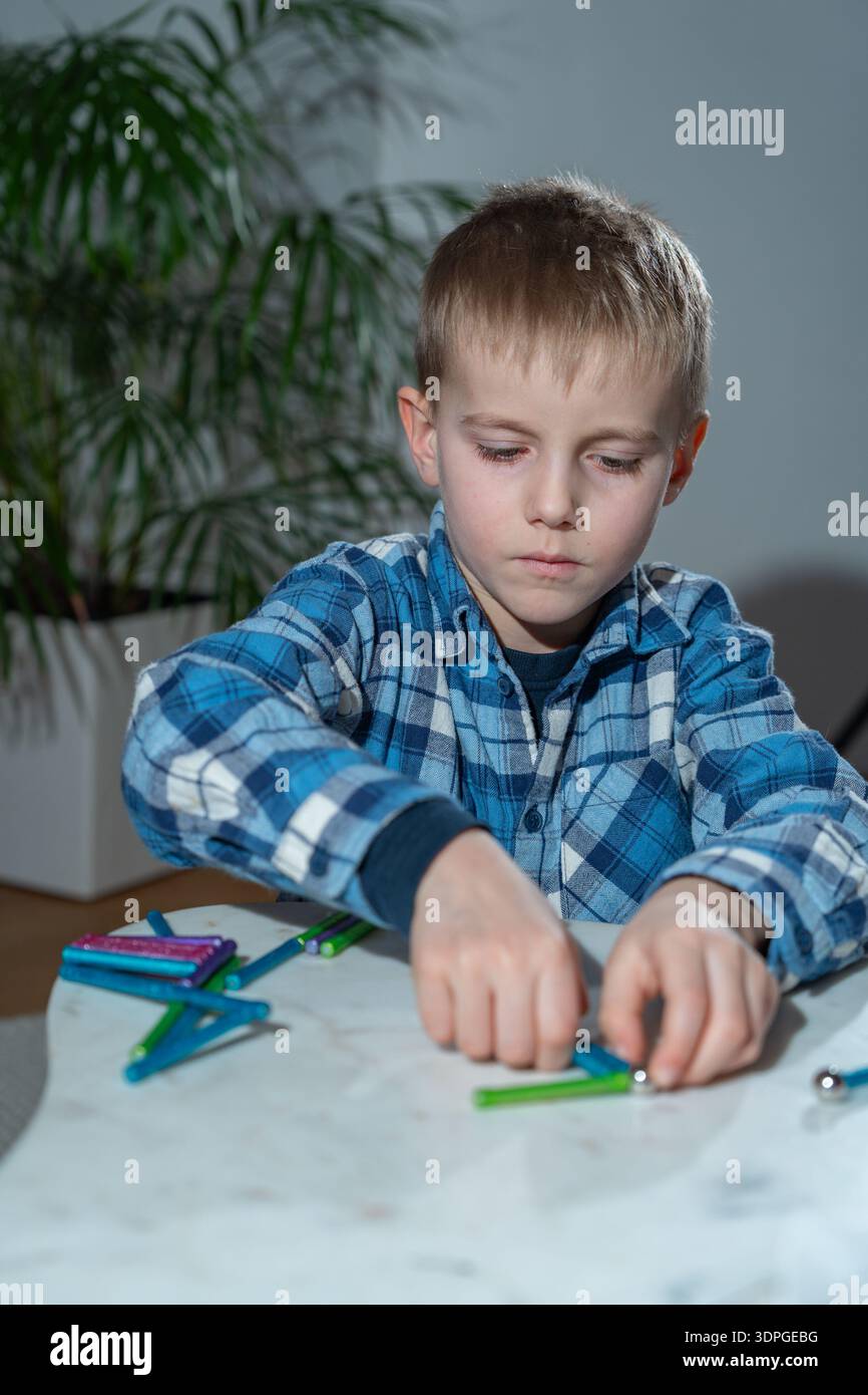 Hands-on STEM learning activity with magnetic structure. Focus on ...