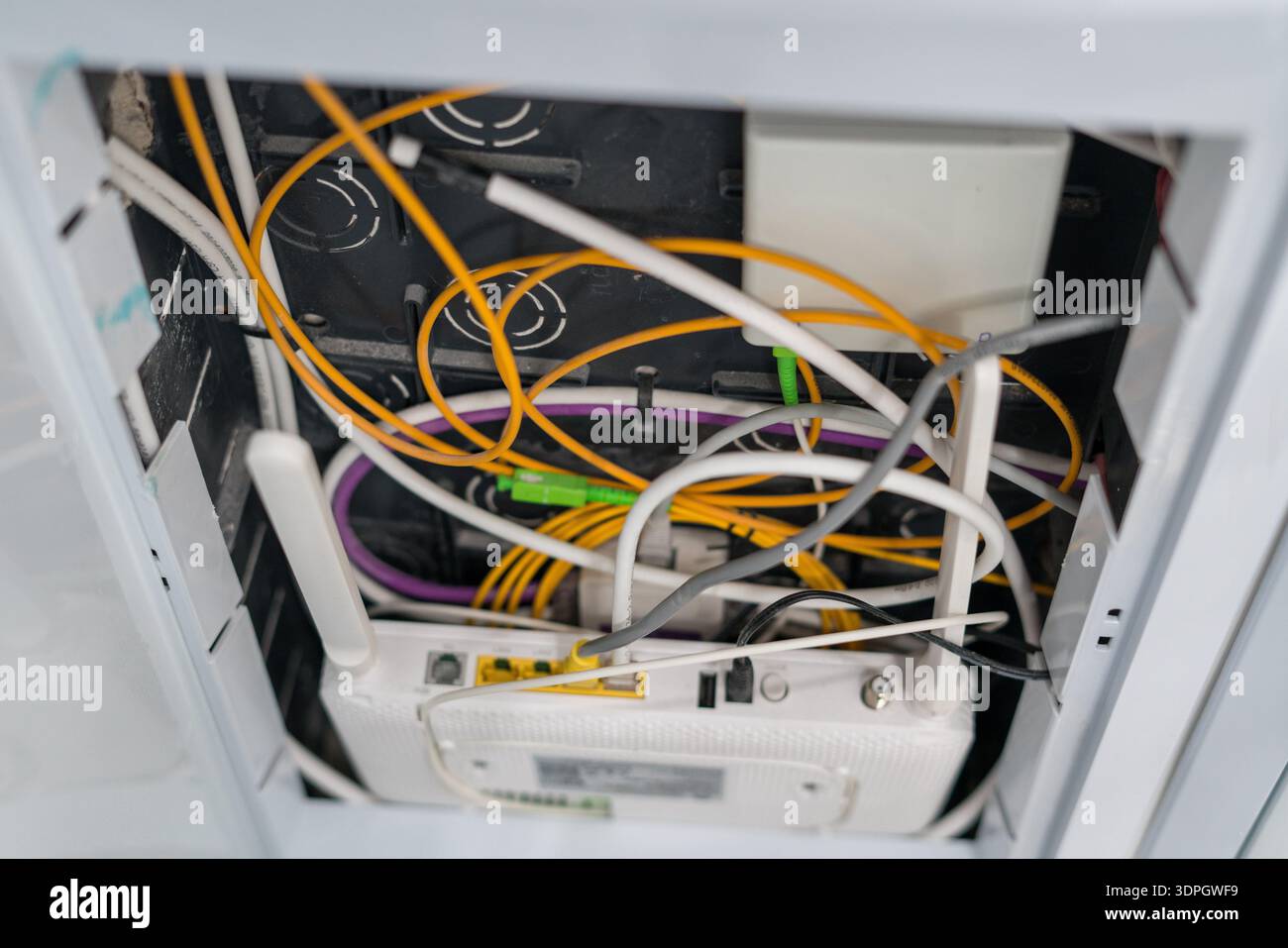 Fiber optic cables connected to internet router in wall box Stock Photo ...