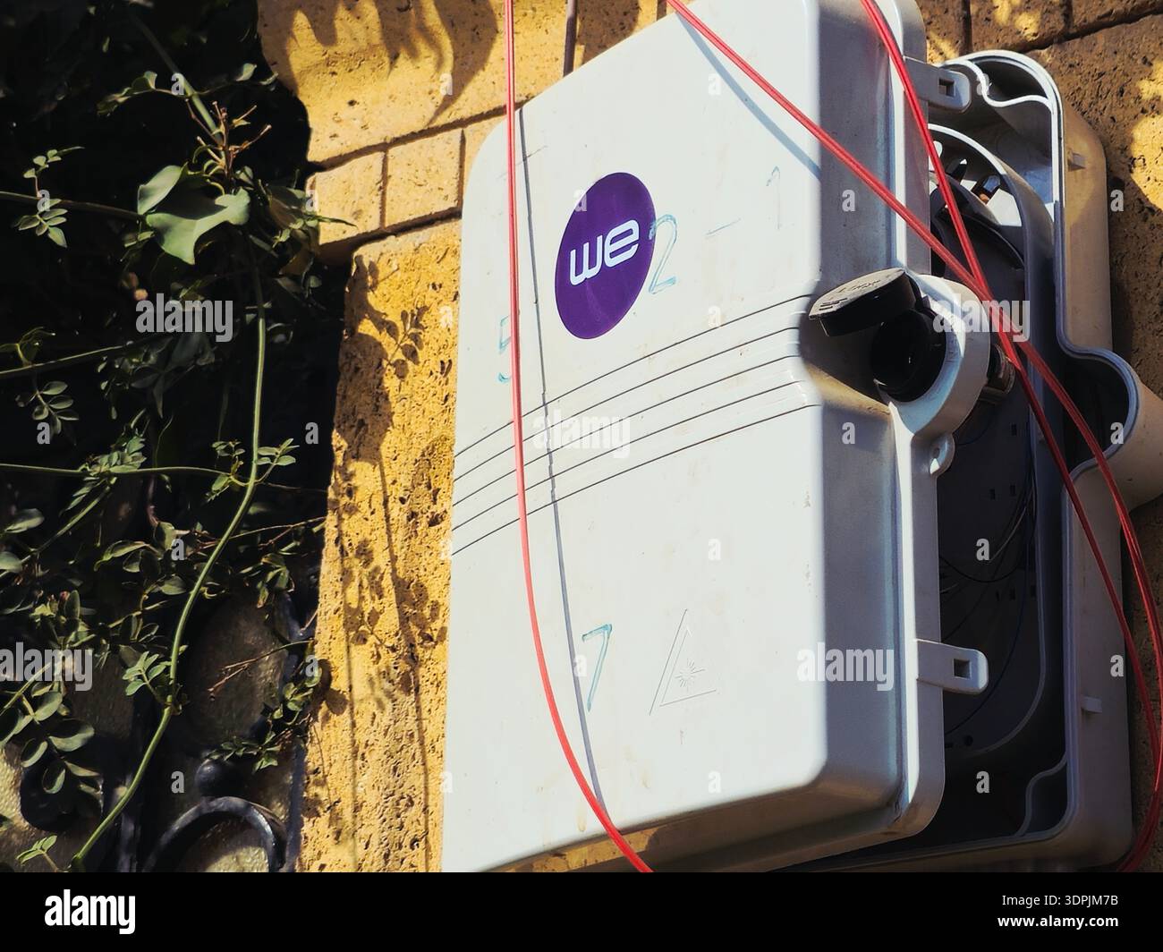 Giza, Egypt, February 4 2026: WE outdoor fiber optic terminal box ...