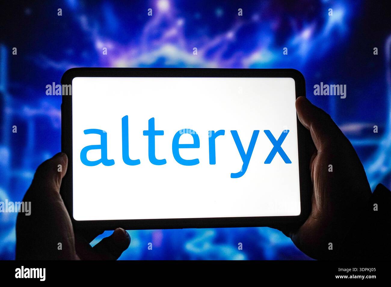 In this photo illustration, the Alteryx logo is displayed on the screen ...