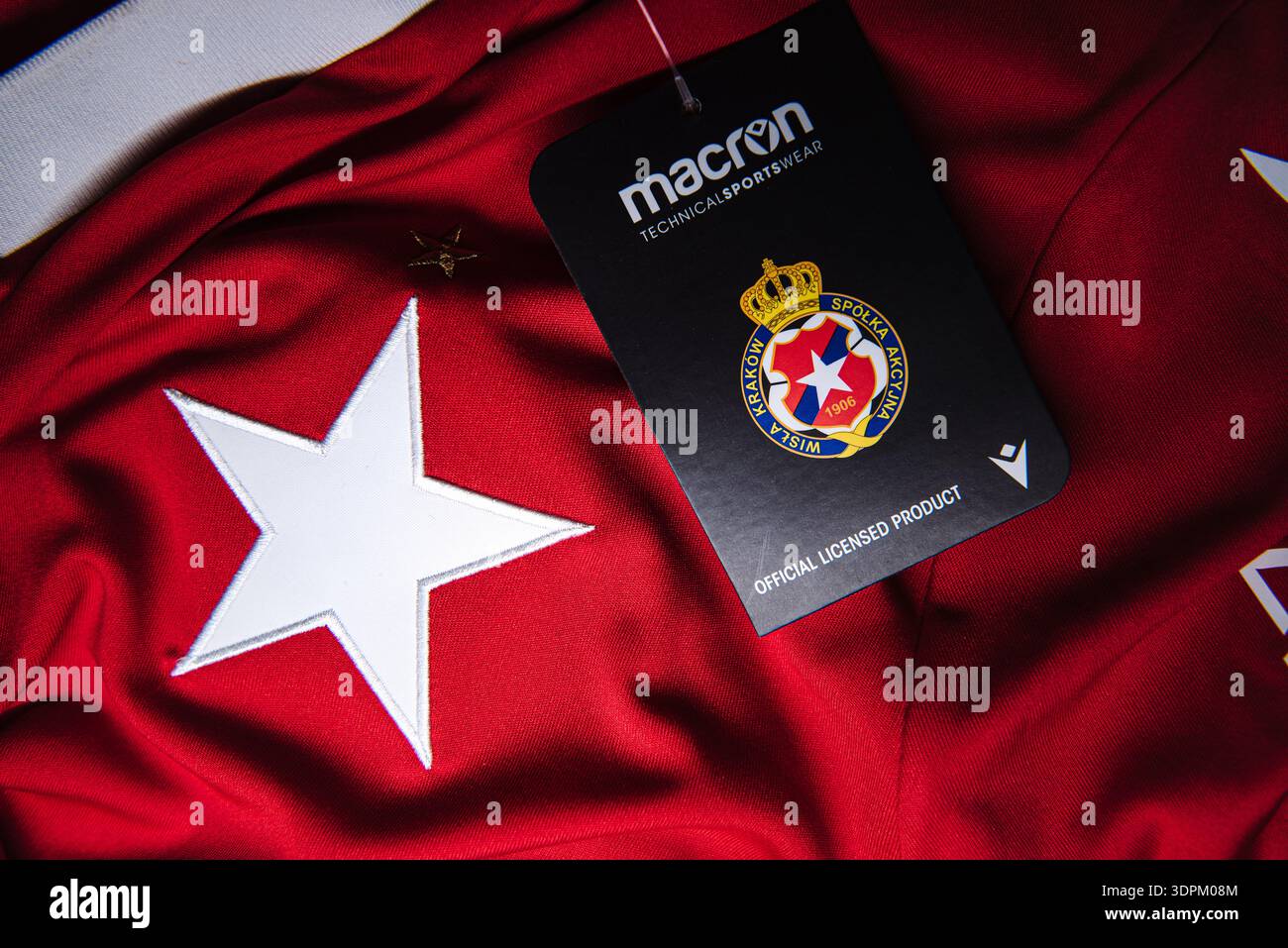 Wisla Krakow white star crest on red jersey with Macron official