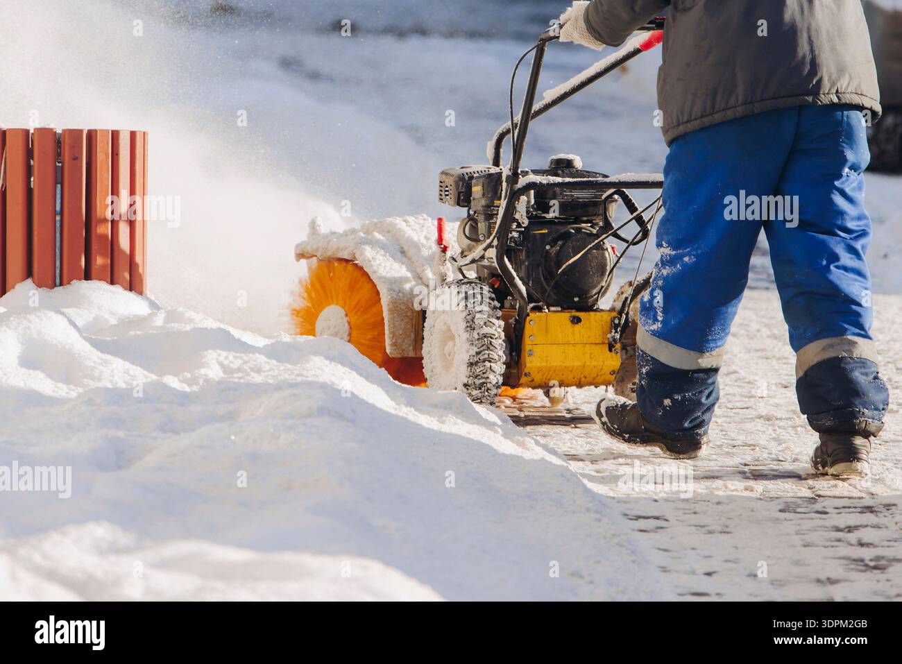 Remove Snow Machine Removing snow with portable blower machine during winter, worker with ...