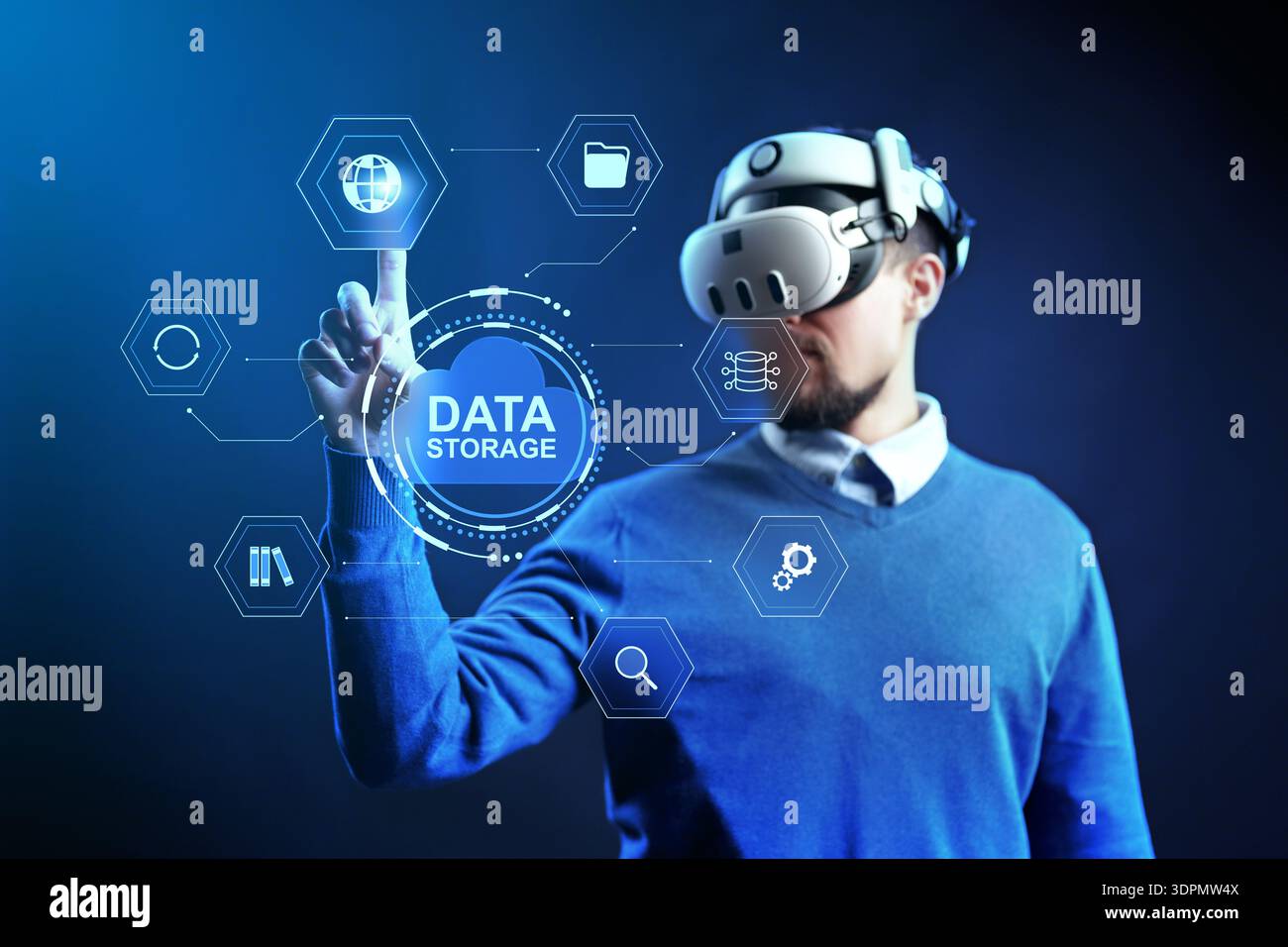 Virtual reality user interacts with data storage display in technology setting Stock Photo