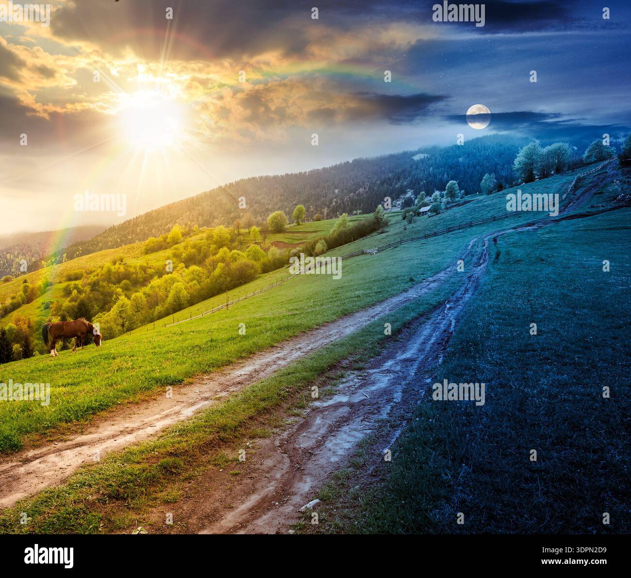 dirt road winding through green rolling hills. day and night time change concept. rural landscape in mountain range with sun and moon at twilight. cou Stock Photo