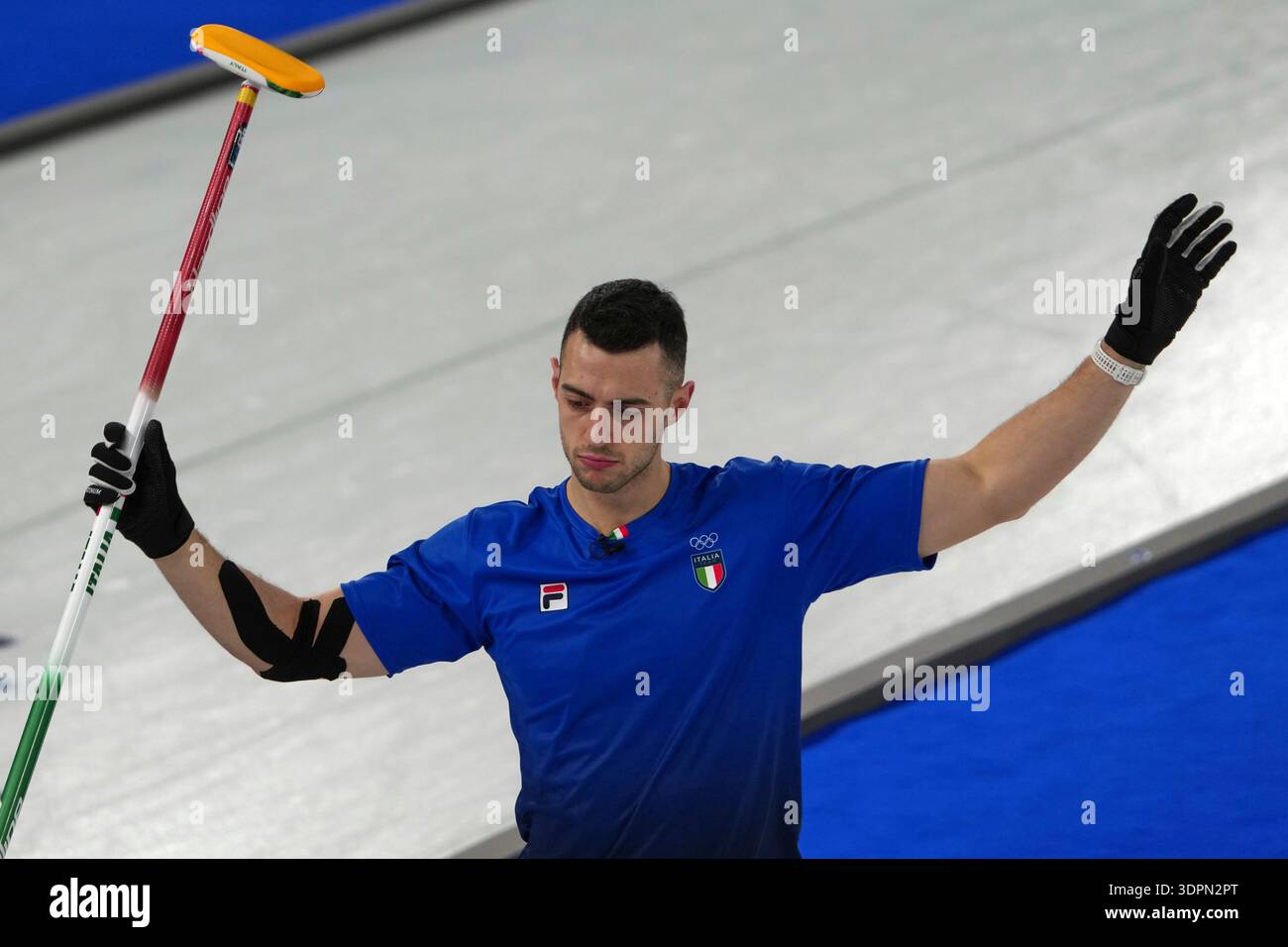 Italy's Sebastiano Arman reacts during the men's curling round robin ...
