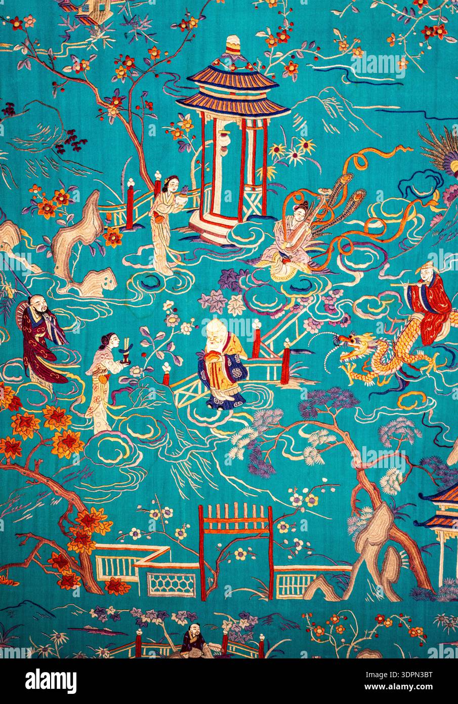 Turquoise Asian-inspired textile illustration with pagoda, figures, cranes, blossoms and swirling clouds; ornate vintage decorative fabric pattern. Stock Photo