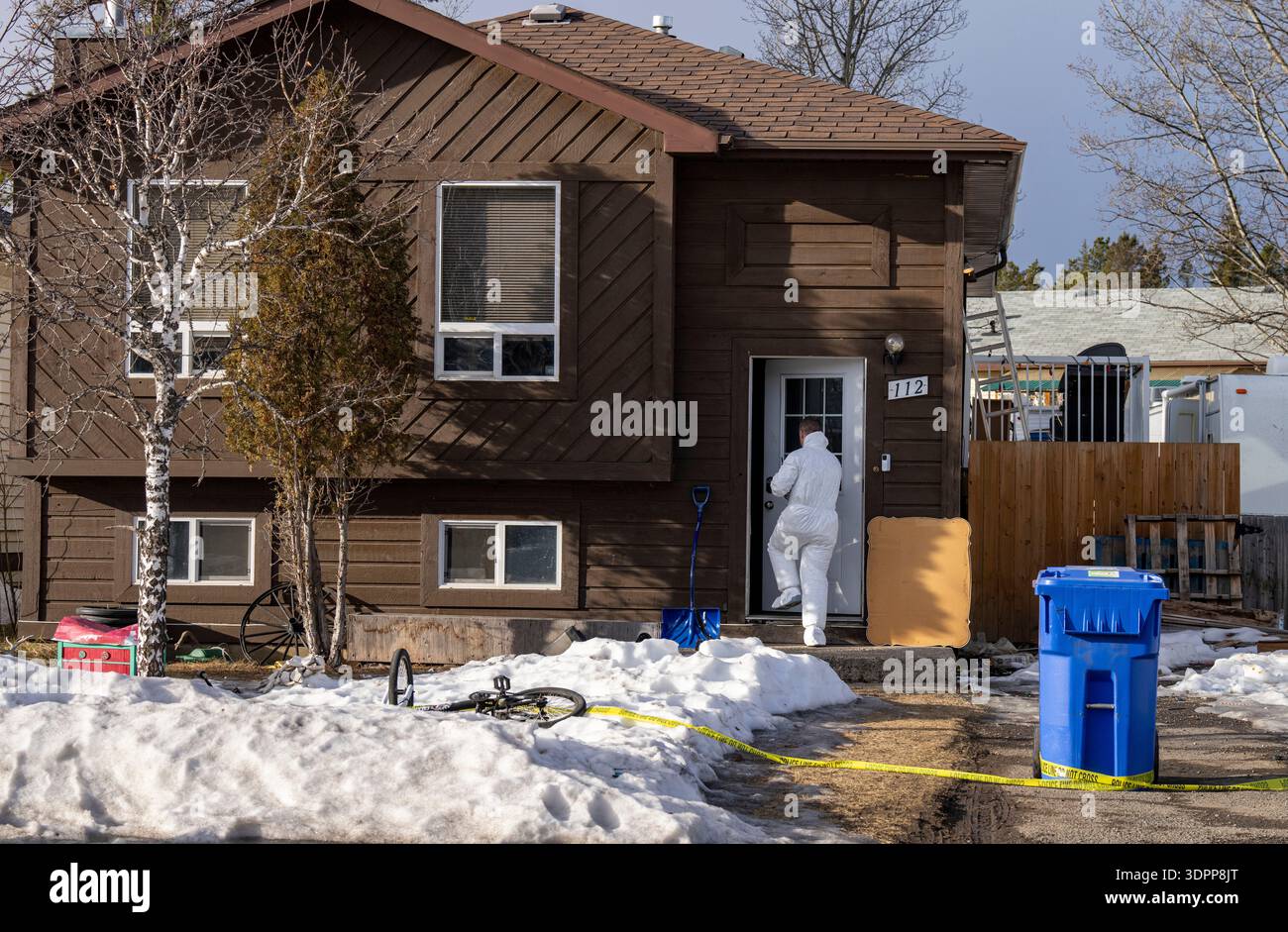 Investigator Ridge A police investigator enters the home where two bodies were found in ...