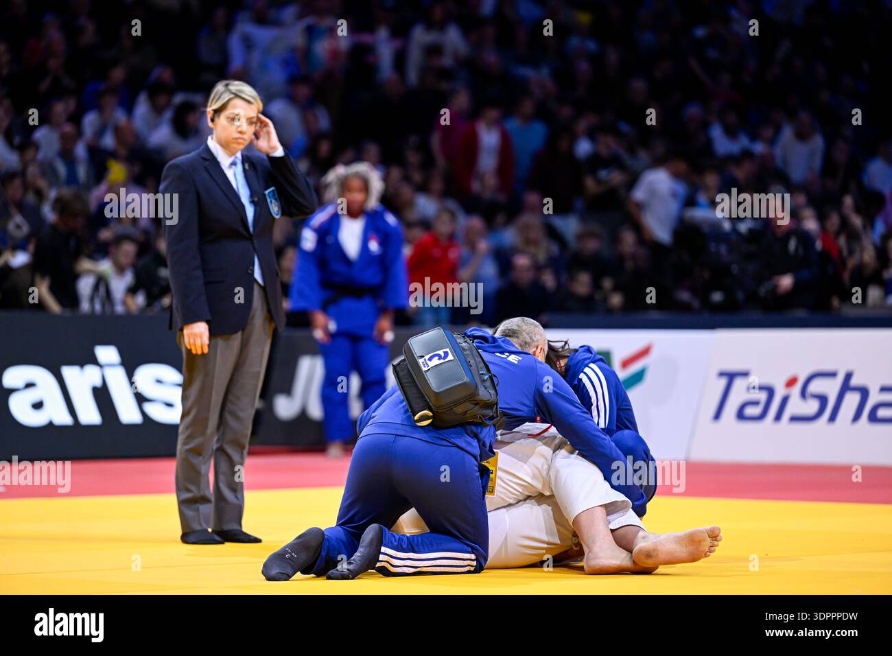 Doctor Rush Medical staff doctor rush to assist a female judoka after she suffers ...