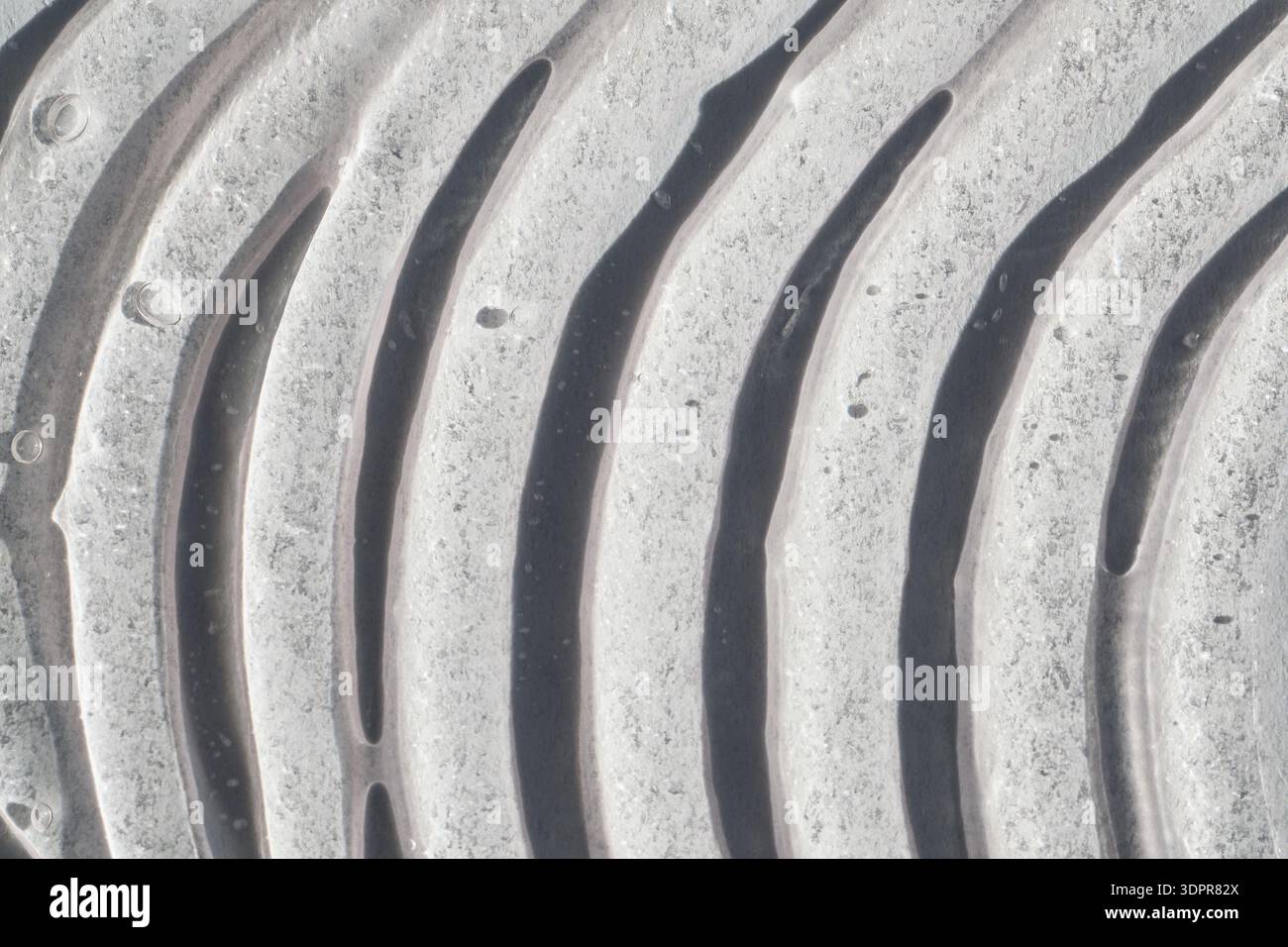 Abstract texture creating pattern of undulating waves with light and shadow Stock Photo