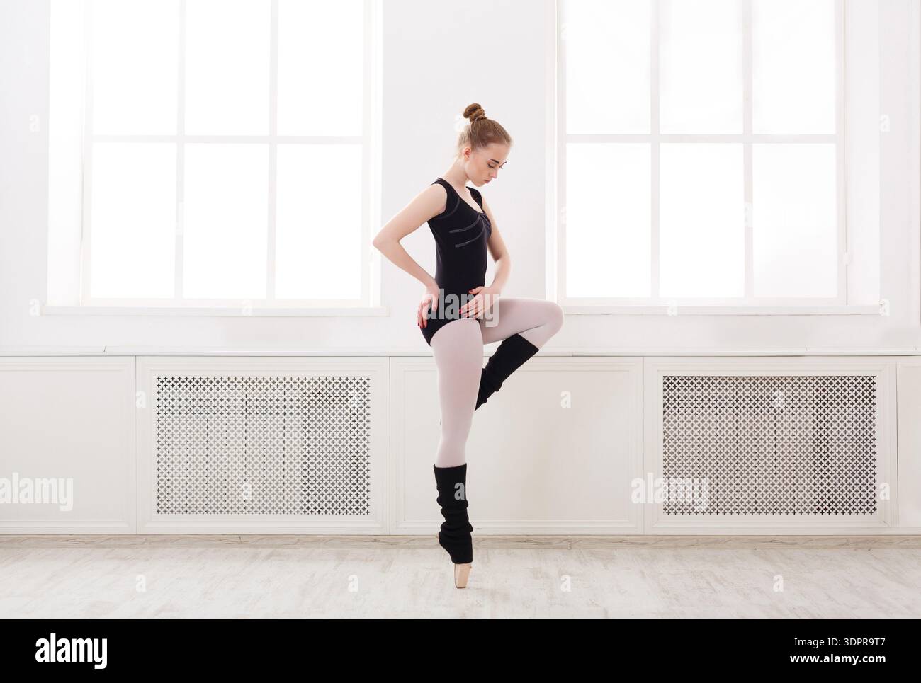 Ballet Dancer Practices in a Bright Studio During the Afternoon Stock Photo