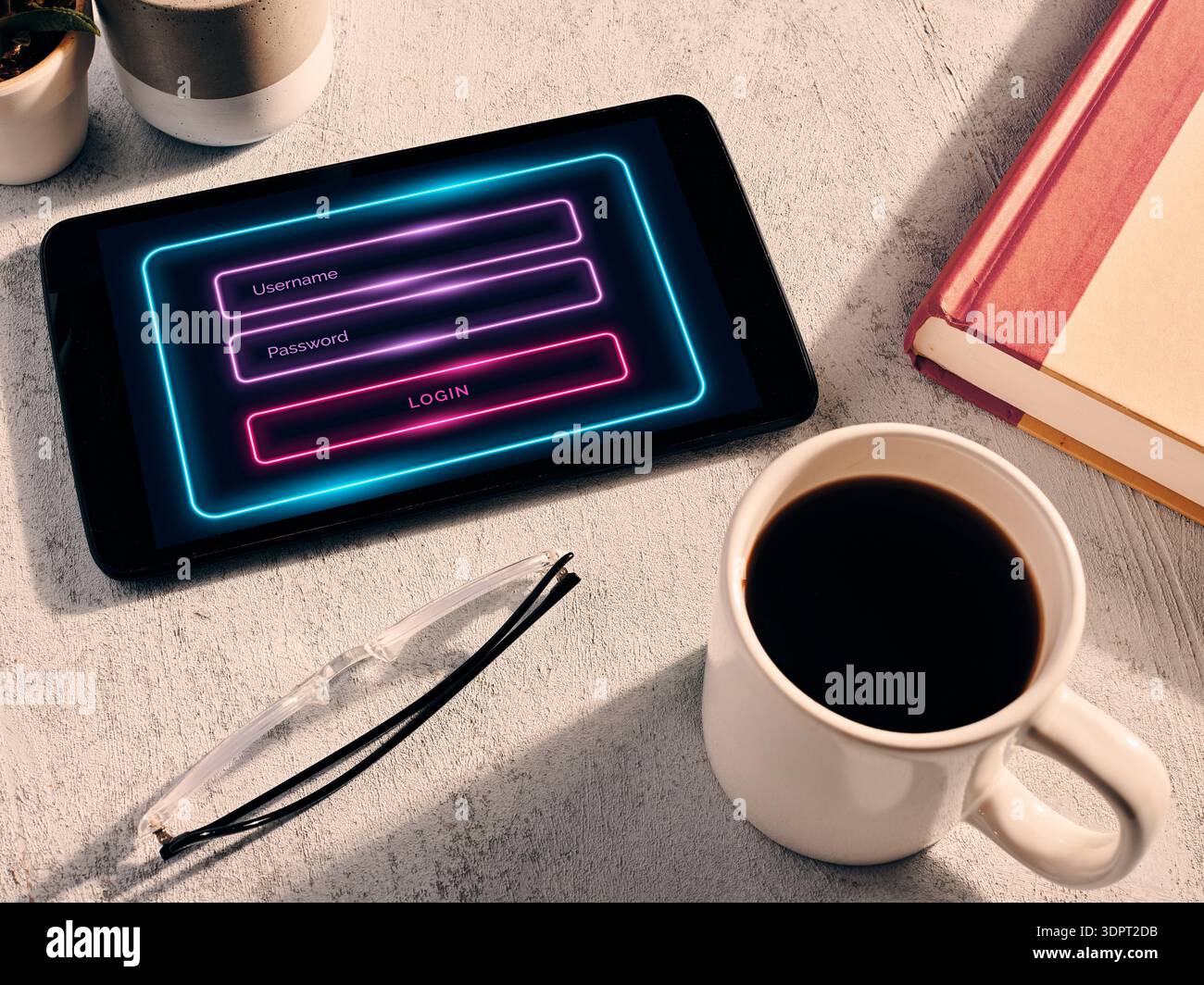 Tablet showing a neon login screen for username and password entry, symbolizing cyber security, online access, and data protection Stock Photo