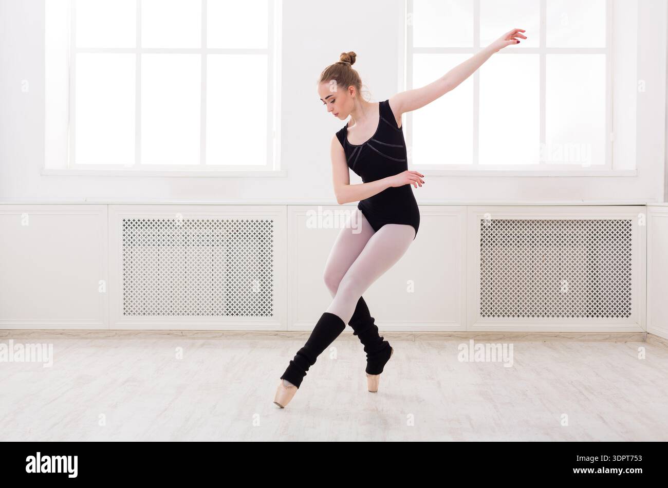 Ballet Dancer Practices in Studio During Daytime Stock Photo