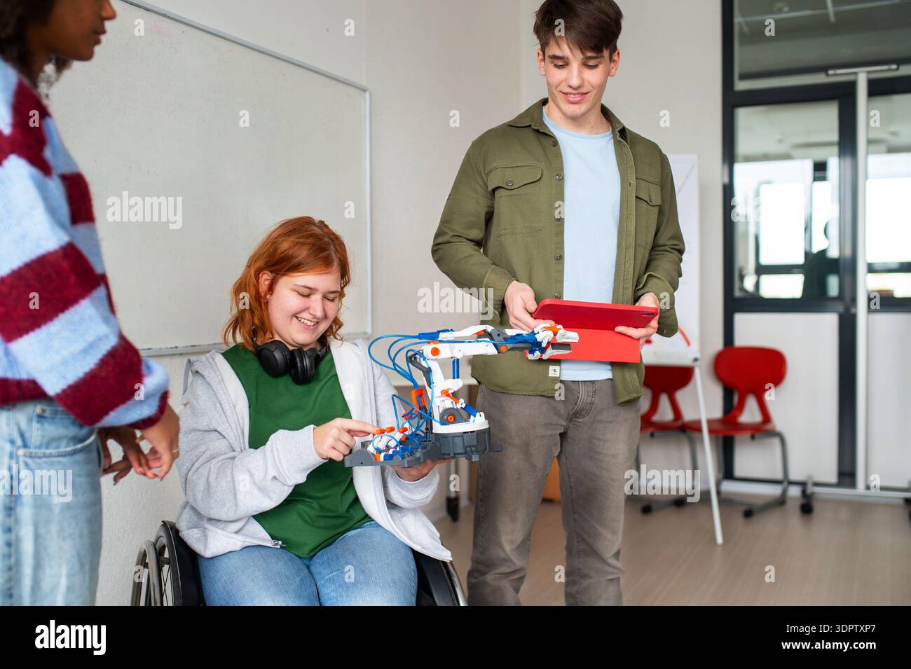Inclusive student team presenting technology project in class. Stock Photo