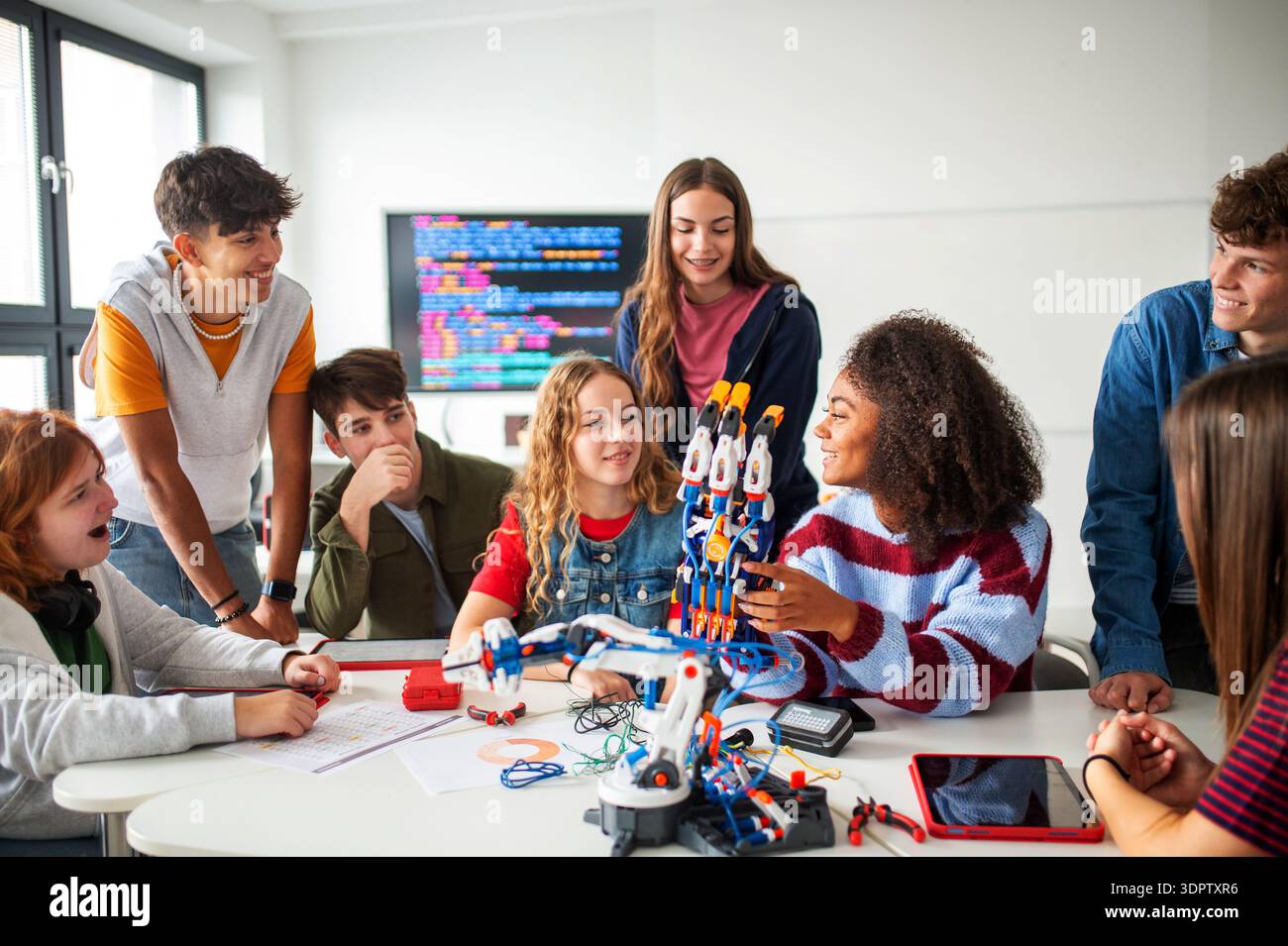 Diverse group of students working on engineering school project. Stock Photo