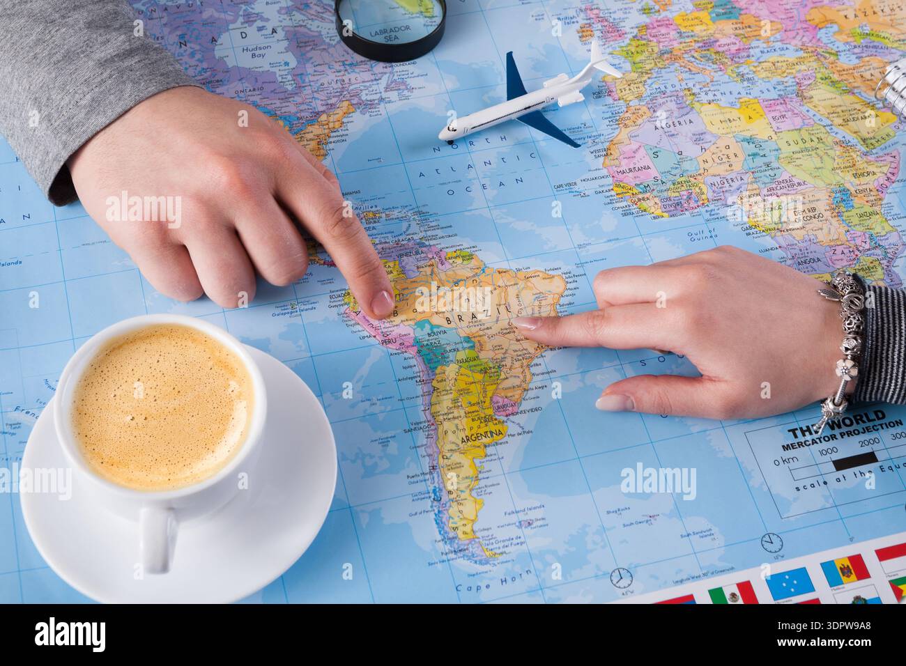 Travel Planning Session Over a World Map With Coffee and Model Plane ...