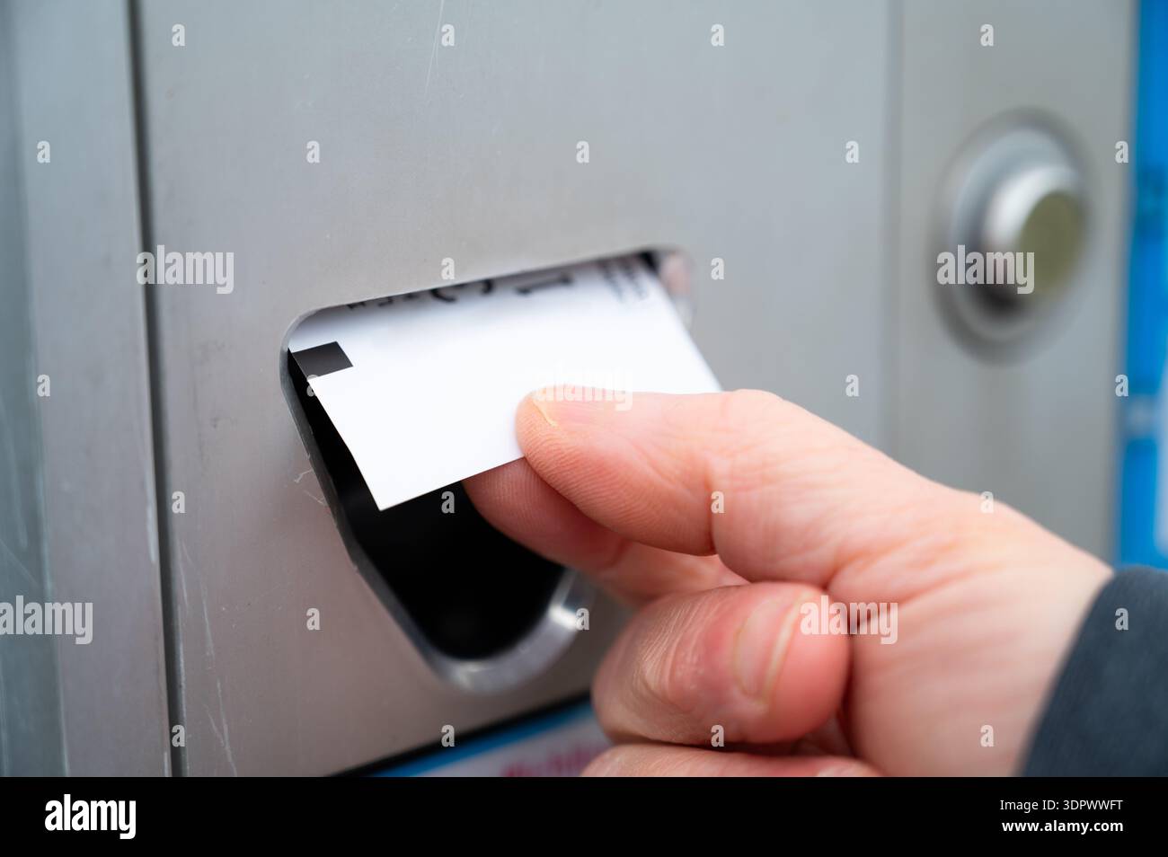 Taking ticket from parking meter, entrance and exit of parked car ...