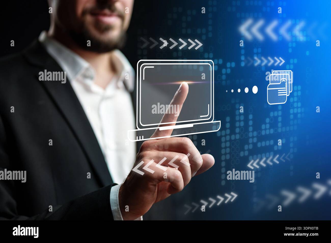 Man interacts with digital interface showing technology and data transfer in a modern setting Stock Photo