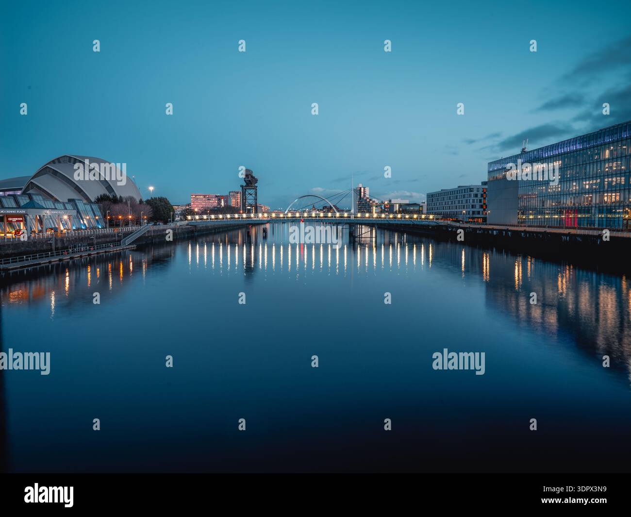 Blue Hour Reflections on River Clyde with Finnieston Crane, Clyde Arc and SEC Armadillo, Glasgow Scotland Stock Photo