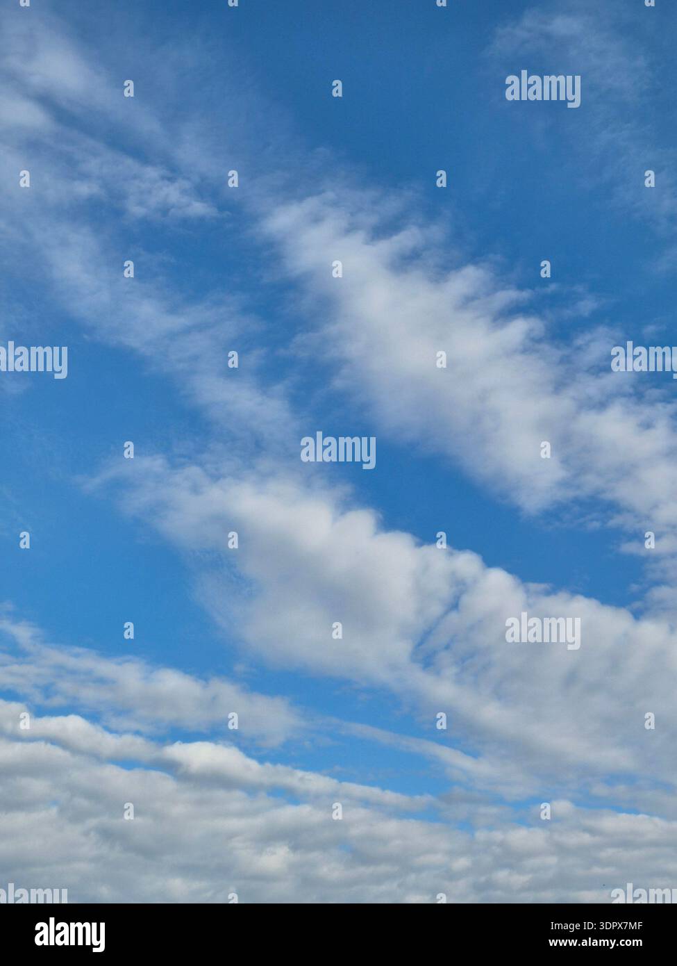 ​Beautiful cloud formation in the clear blue sky, copy space - Smartphone Captured Stock Image