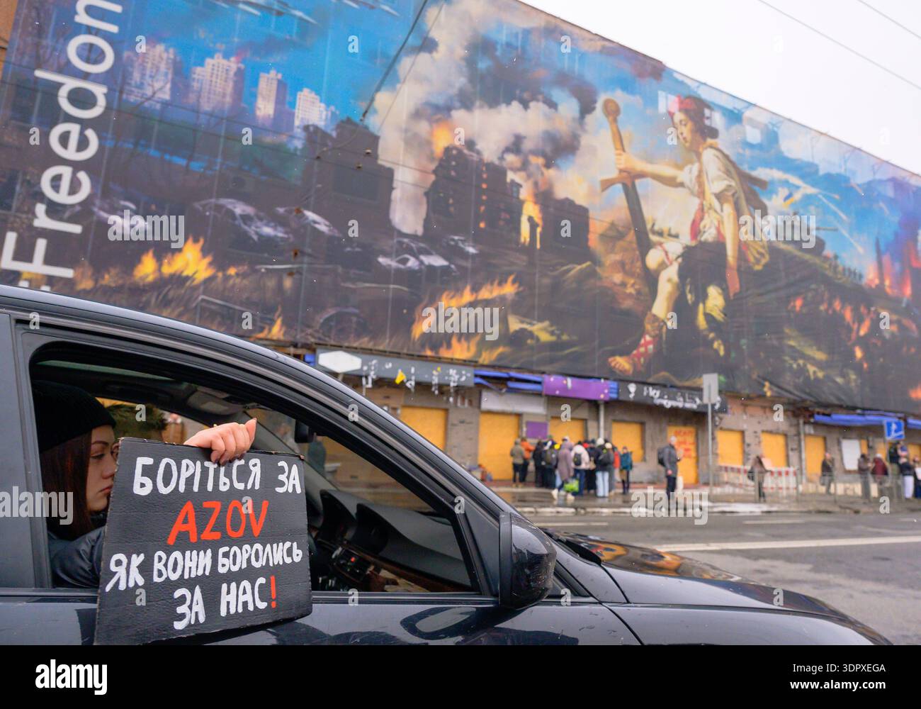 Kyiv, Ukraine - 16th February,2026: Woman in car holding Fight for Azov ...