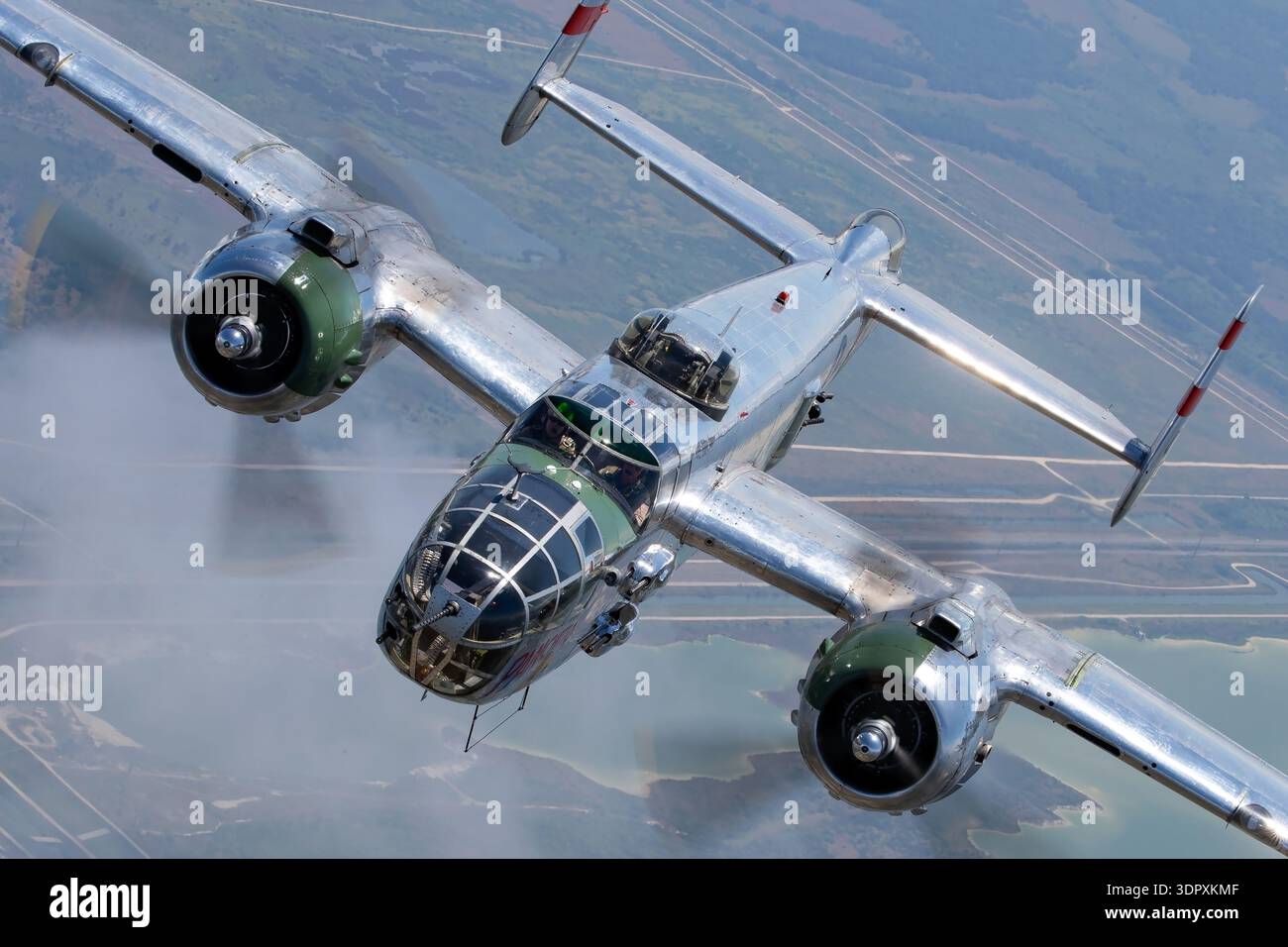 Banking overhead air to air view of North American B-25J Mitchell ...