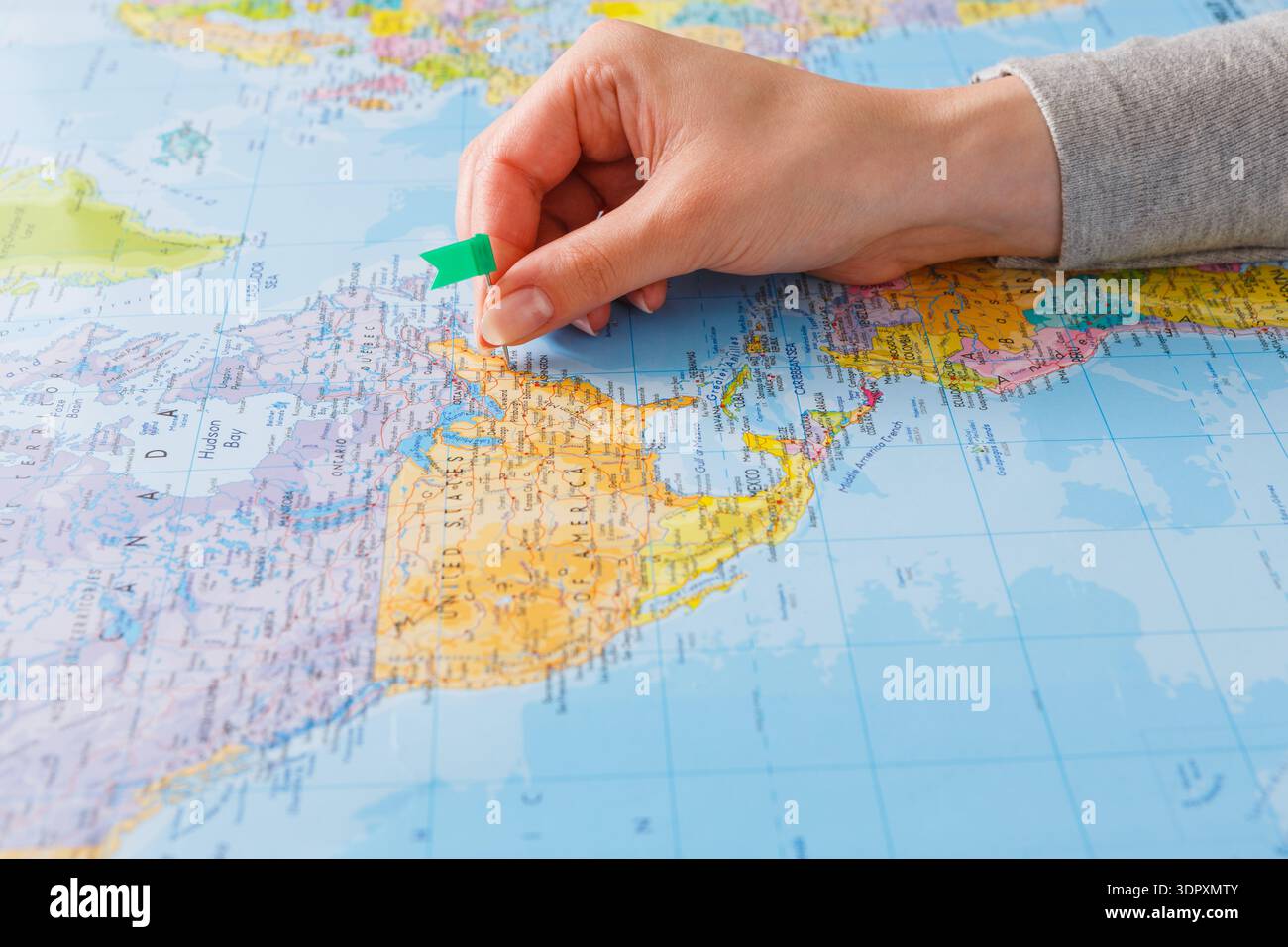 Hand Places a Green Pin on Map of North America Highlighting a Specific ...