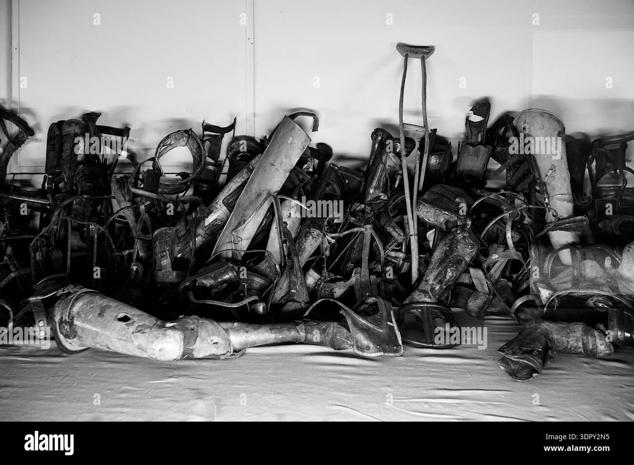 Pile of prosthetic limbs and crutches belonging to victims on display ...