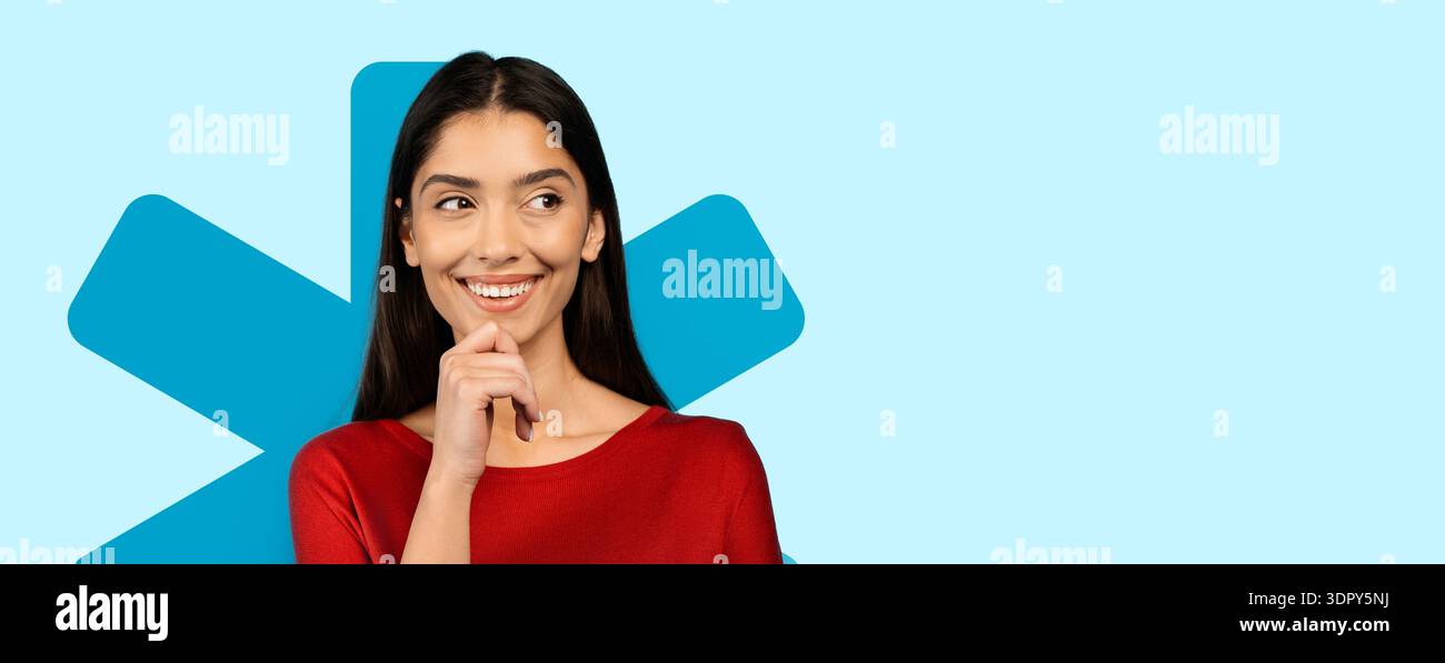 Woman Smiles While Posing in Front of Light Blue Background With a ...
