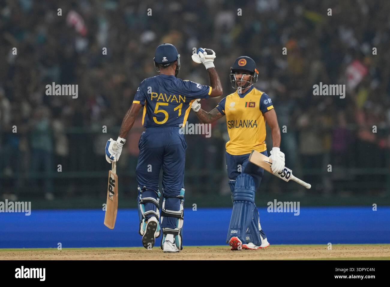 Sri Lanka's Pavan Rathnayake, left, and Sri Lanka's Pathum Nissanka ...