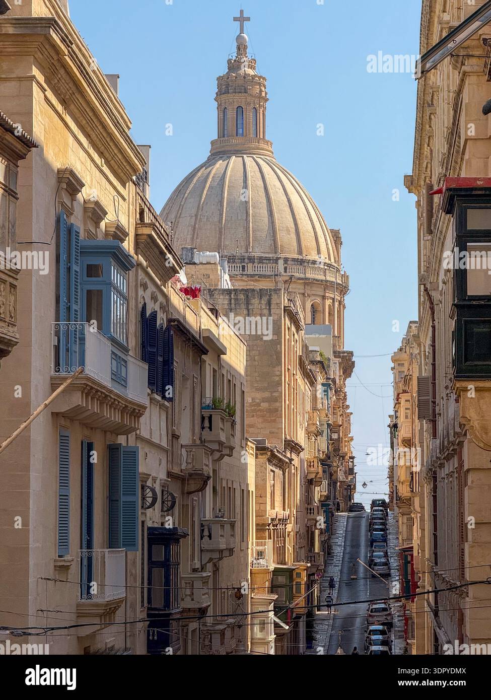 view-along-a-narrow-limestone-street-in-valletta-with-maltese-balconies