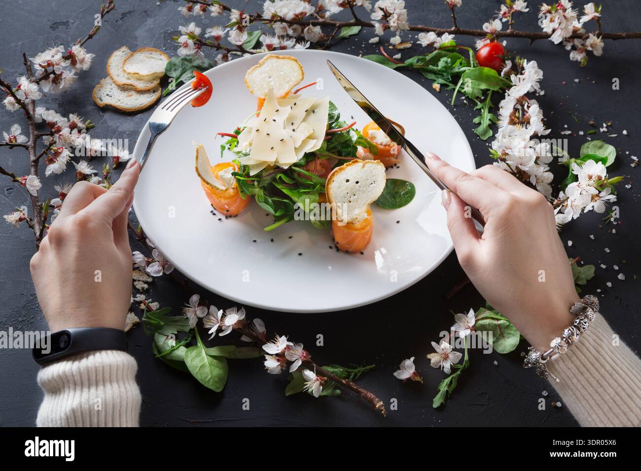 Fresh Salad Served With Shrimp and Garnished With Flowers in a Casual Dining Setting Stock Photo