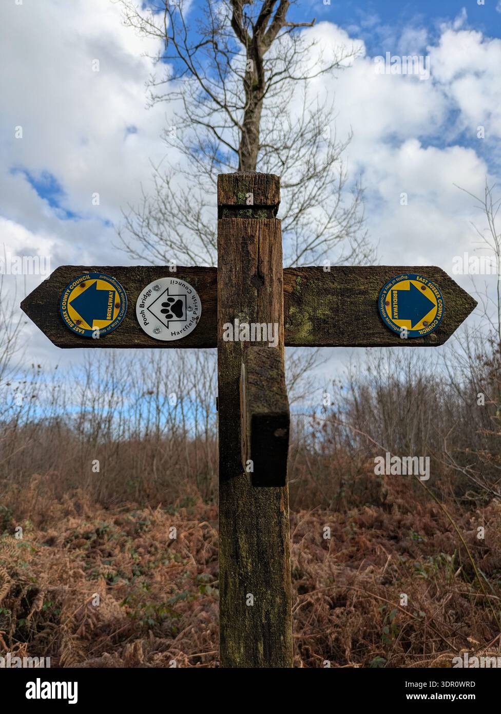 Directional sign on the path at Ashdown Forest, East Sussex, aka the real Hundred Acre Wood from A. A. Milne's Winnie-the-Pooh - Smartphone Captured Stock Image