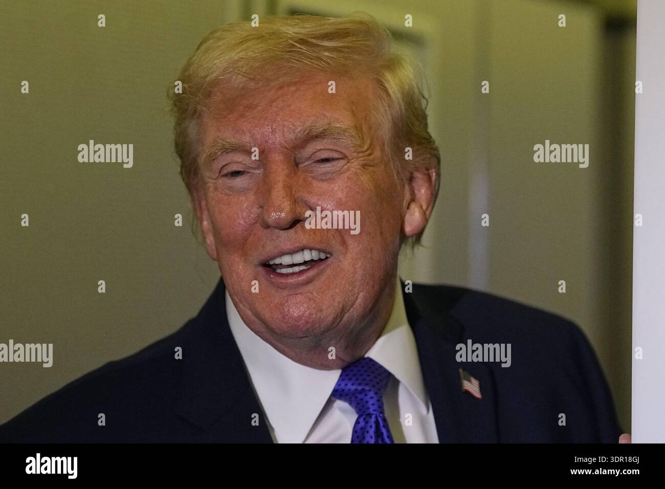 President Donald Trump speaks with reporters aboard Air Force One ...