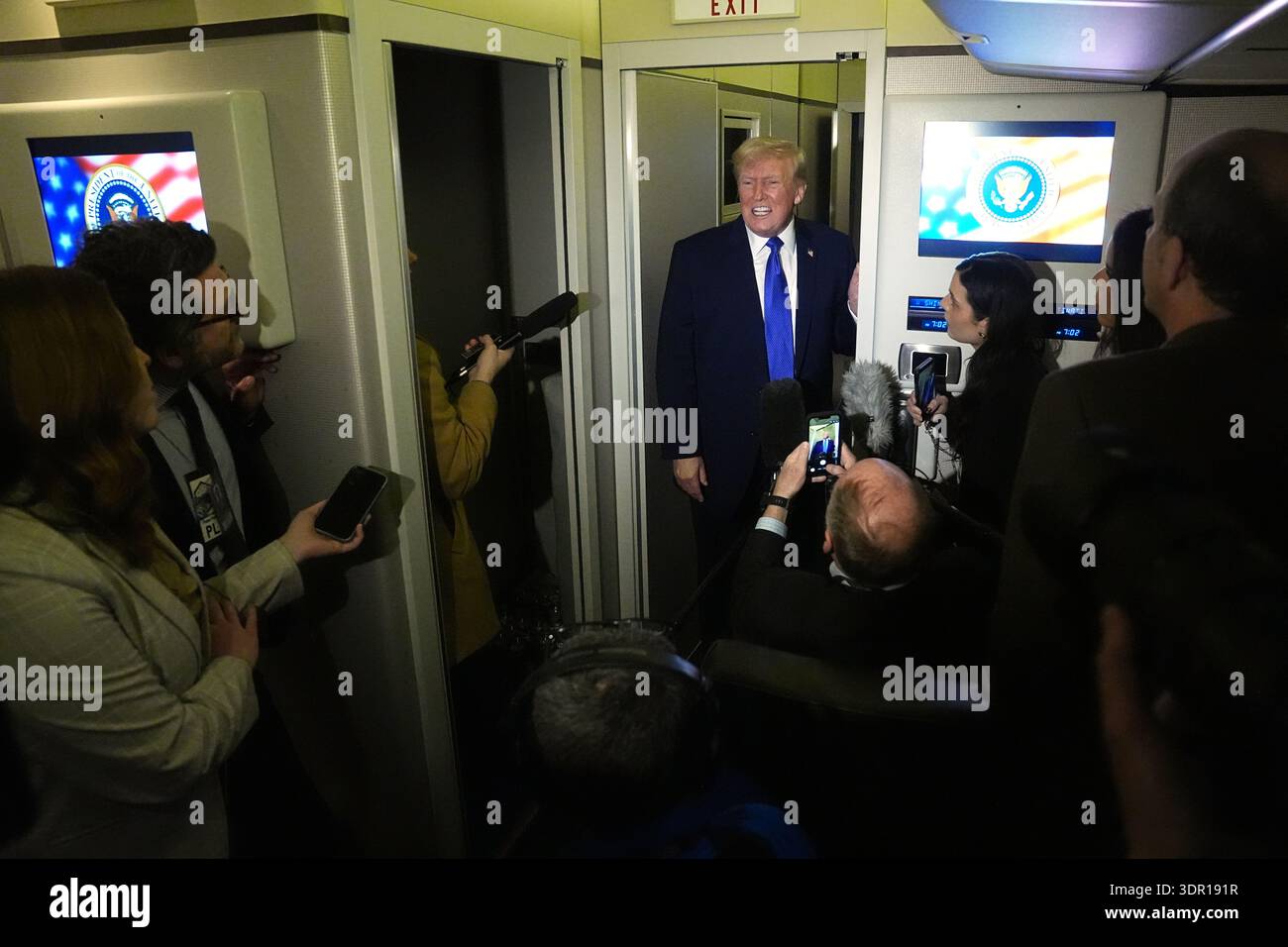 President Donald Trump speaks with reporters aboard Air Force One ...