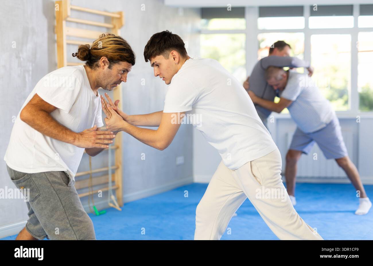 Two men training judo technique in studio Stock Photo - Alamy