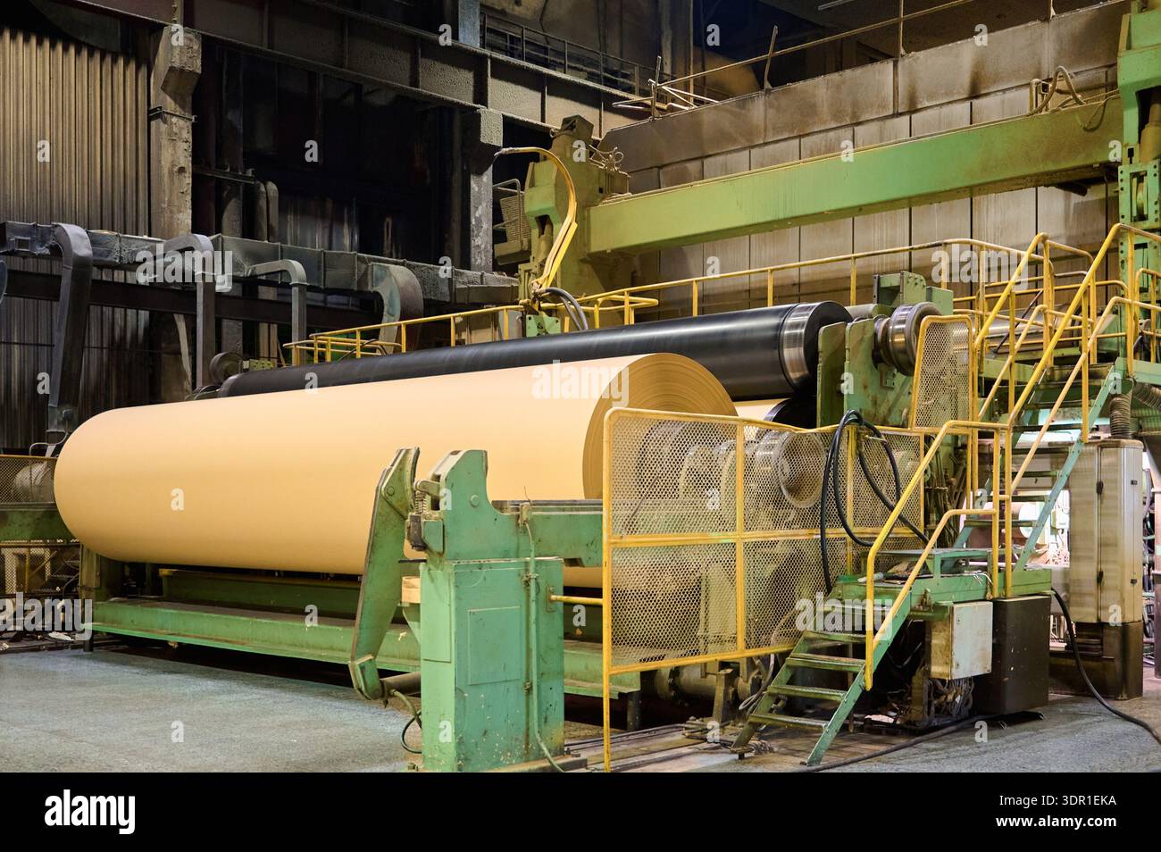 Large paper machine in operation at a paper mill, showcasing the ...