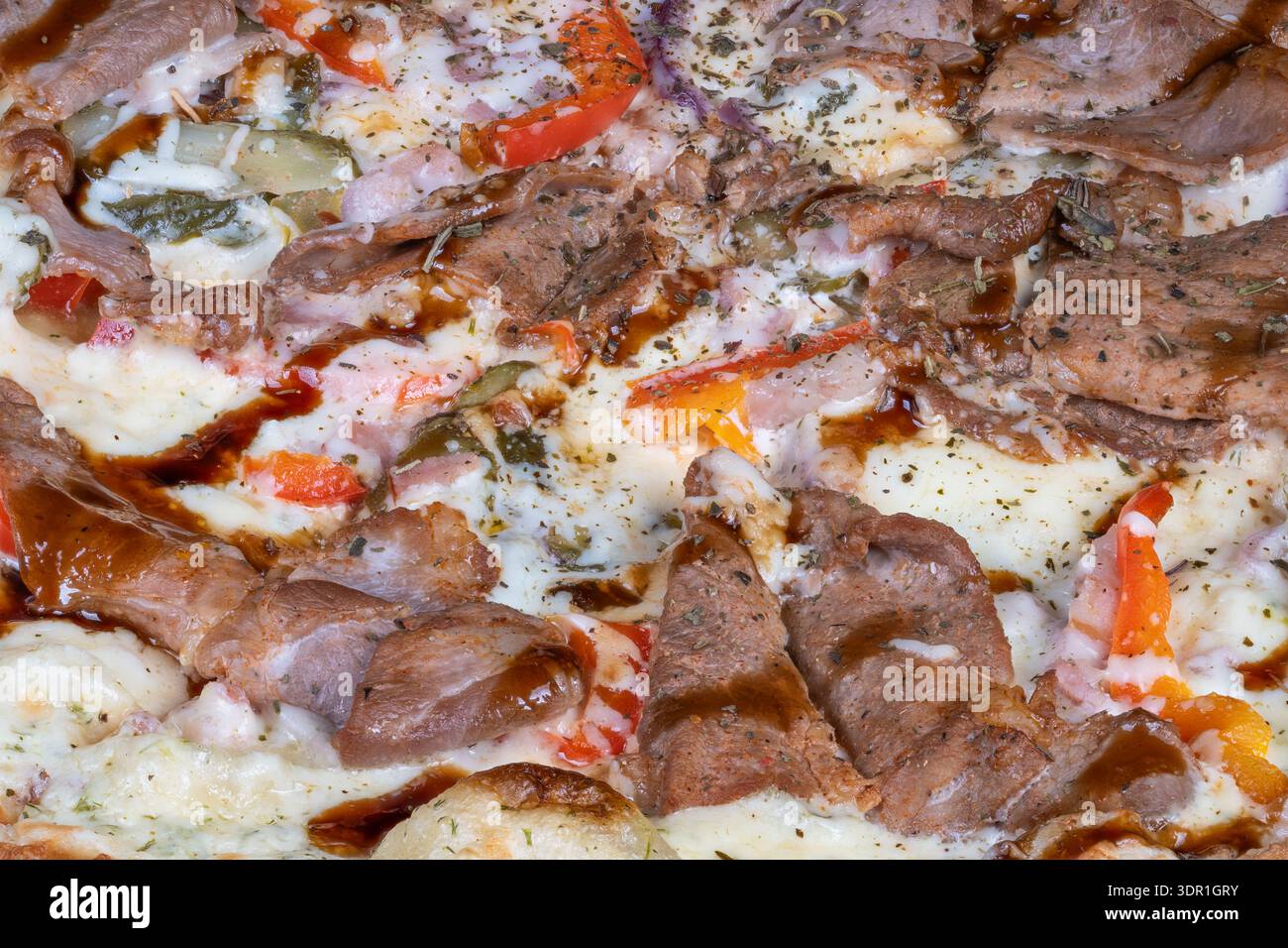 Detailed view meaty pizza drizzle of teriyaki sauce, bubbling cheese ...