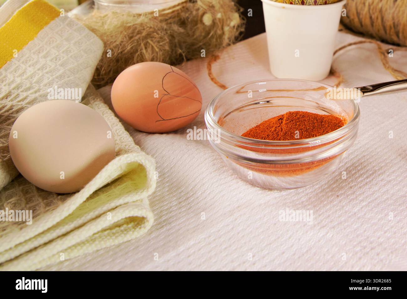 Preparing Easter eggs with wax tool candle and natural dyes Stock Photo