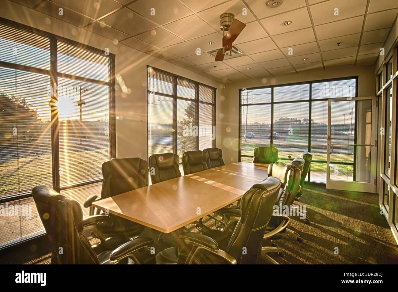 Sun Rays Room Well lit conference room with sun rays shining through Stock Photo - Alamy