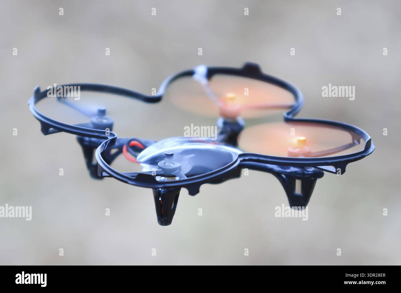 Remote controlled quadcopter drone in mid air Stock Photo