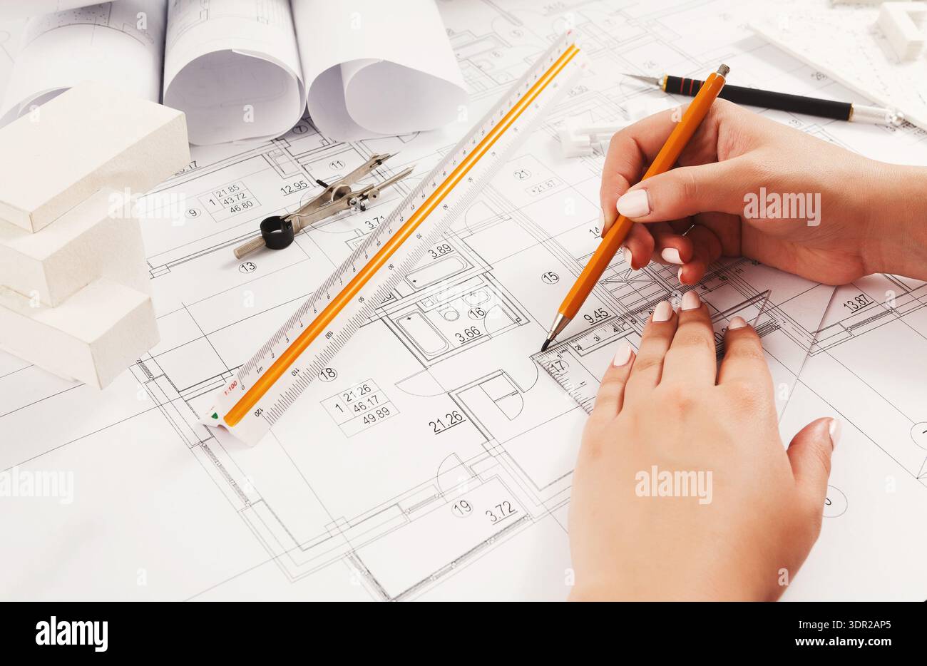 Planning a Building Project With Sketches and Design Tools on a Workspace Stock Photo